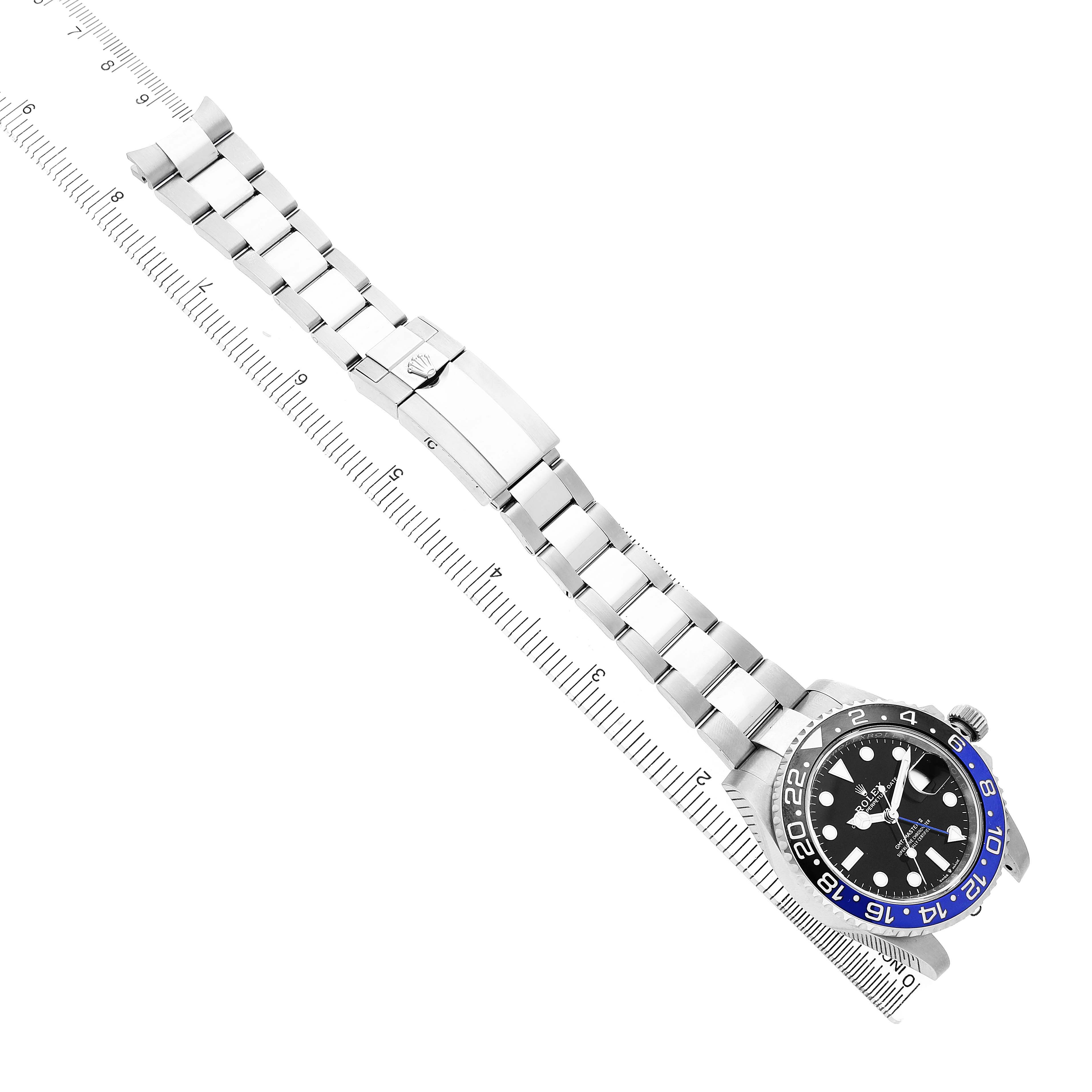 The Rolex GMT-Master 126710 Men's Stainless Steel Black Dial watch is shown from a top view, displaying the strap, clasp, and partial face with bezel markings.