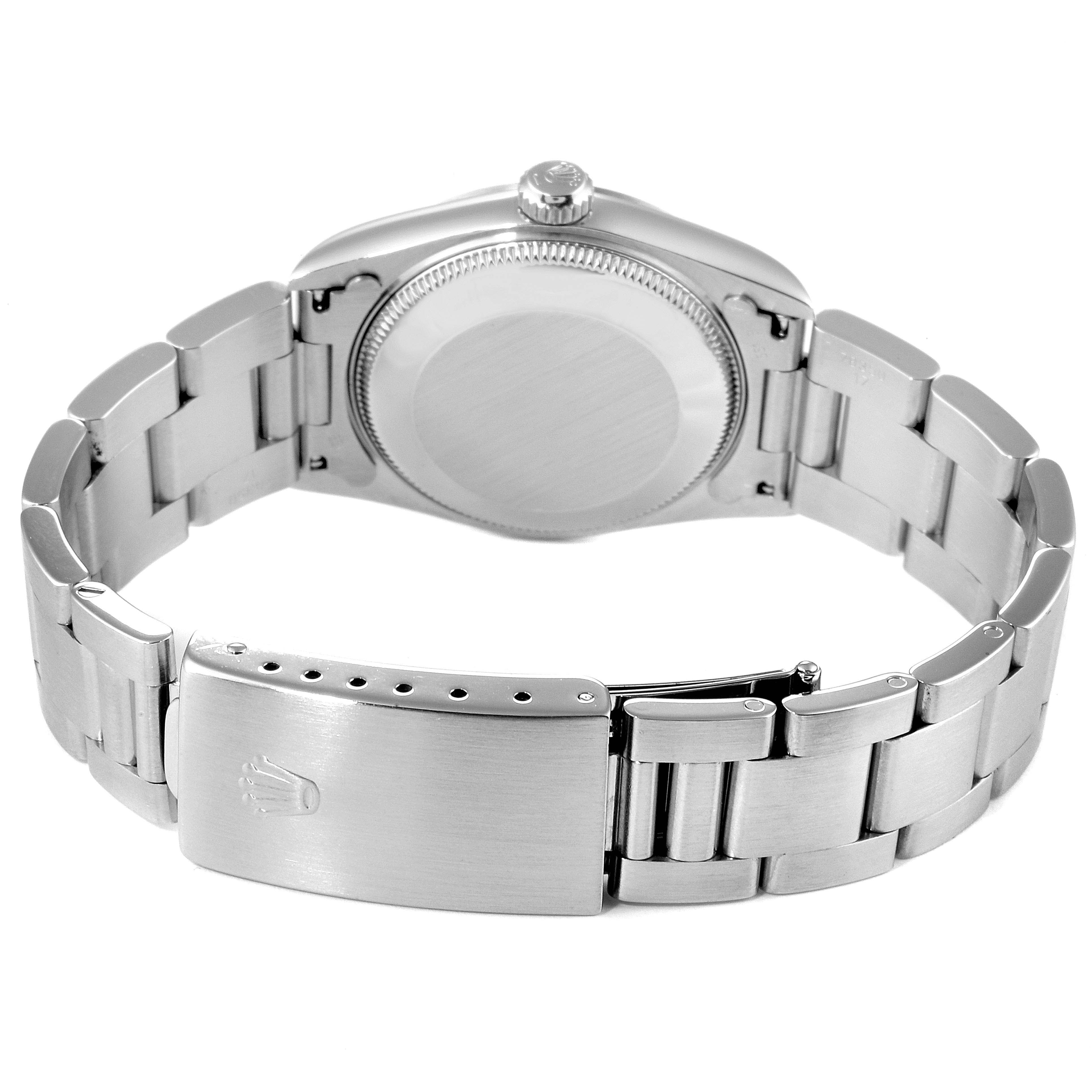 This image shows the back and bracelet clasp of a Mid-Size Rolex watch.