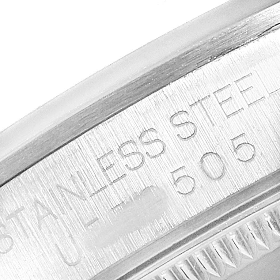 This close-up image shows the side of the Mid-Size Rolex watch case, highlighting the "Stainless Steel" engraving.