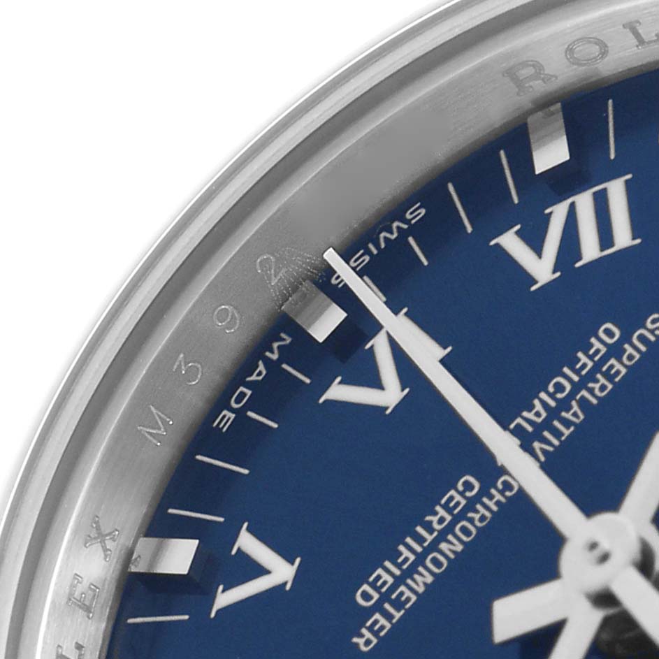 The image shows a close-up of the dial and bezel of a Rolex Oyster Perpetual 176200 Women's Stainless Steel Blue Dial 176200 Women's Stainless Steel Blue Dial watch, highlighting the hour markers and minute hand.