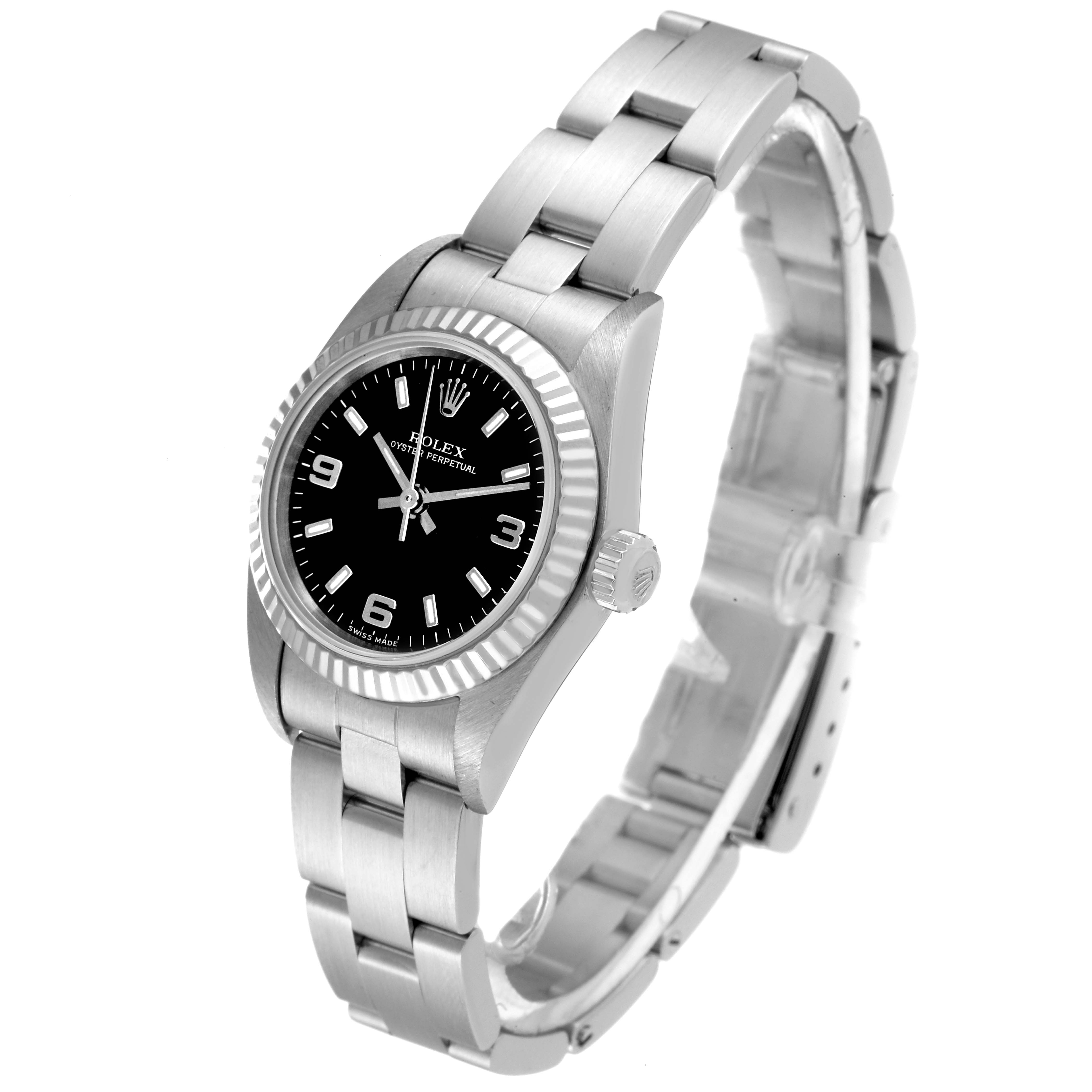 This image shows a side view of a Rolex Oyster Perpetual 76094 Women's Stainless Steel Black Dial 76094 Women's Stainless Steel Black Dial watch, highlighting the black dial, fluted bezel, crown, and bracelet.