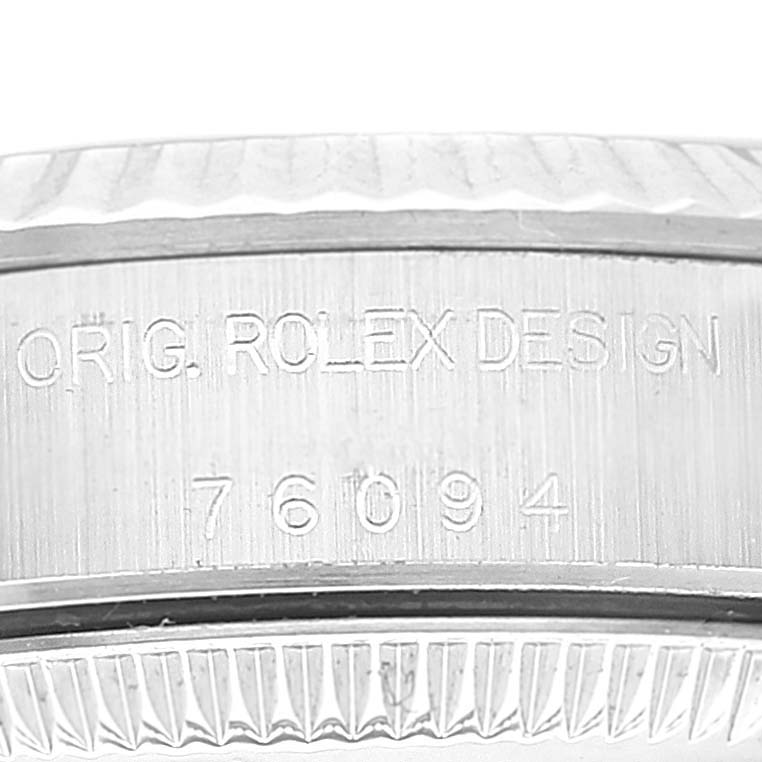 This image shows the engraved side of the case of an Oyster Perpetual Rolex watch, displaying "ORIG. ROLEX DESIGN" and model number 76094.