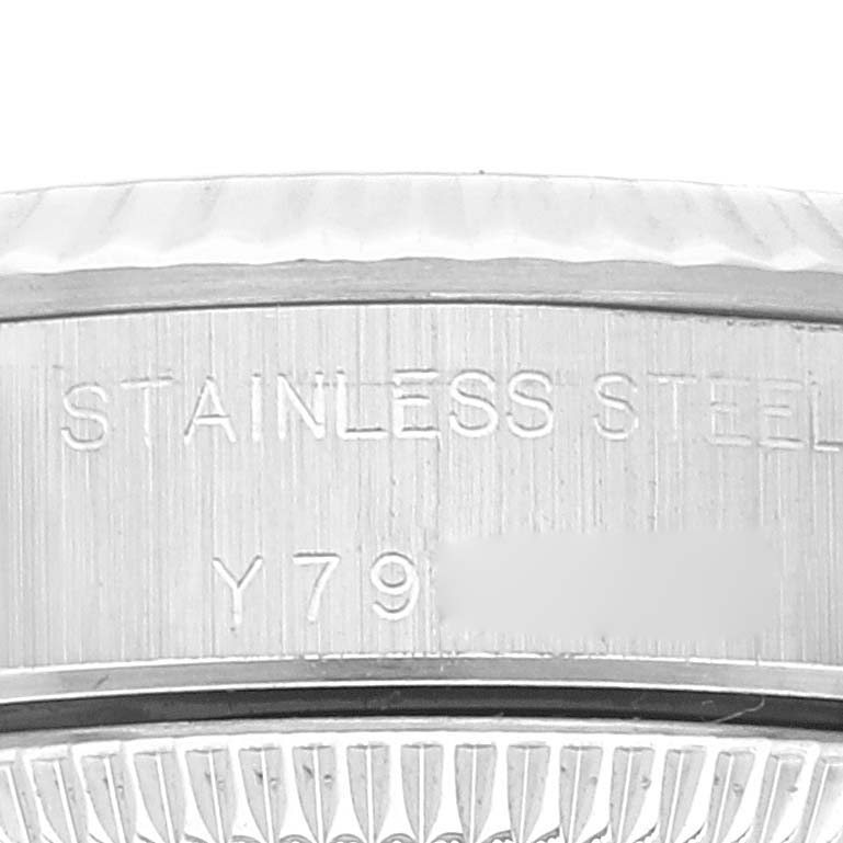 This close-up image shows the stainless steel case back with a partial serial number of the Rolex Oyster Perpetual 76094 Women's Stainless Steel Black Dial 76094 Women's Stainless Steel Black Dial watch.