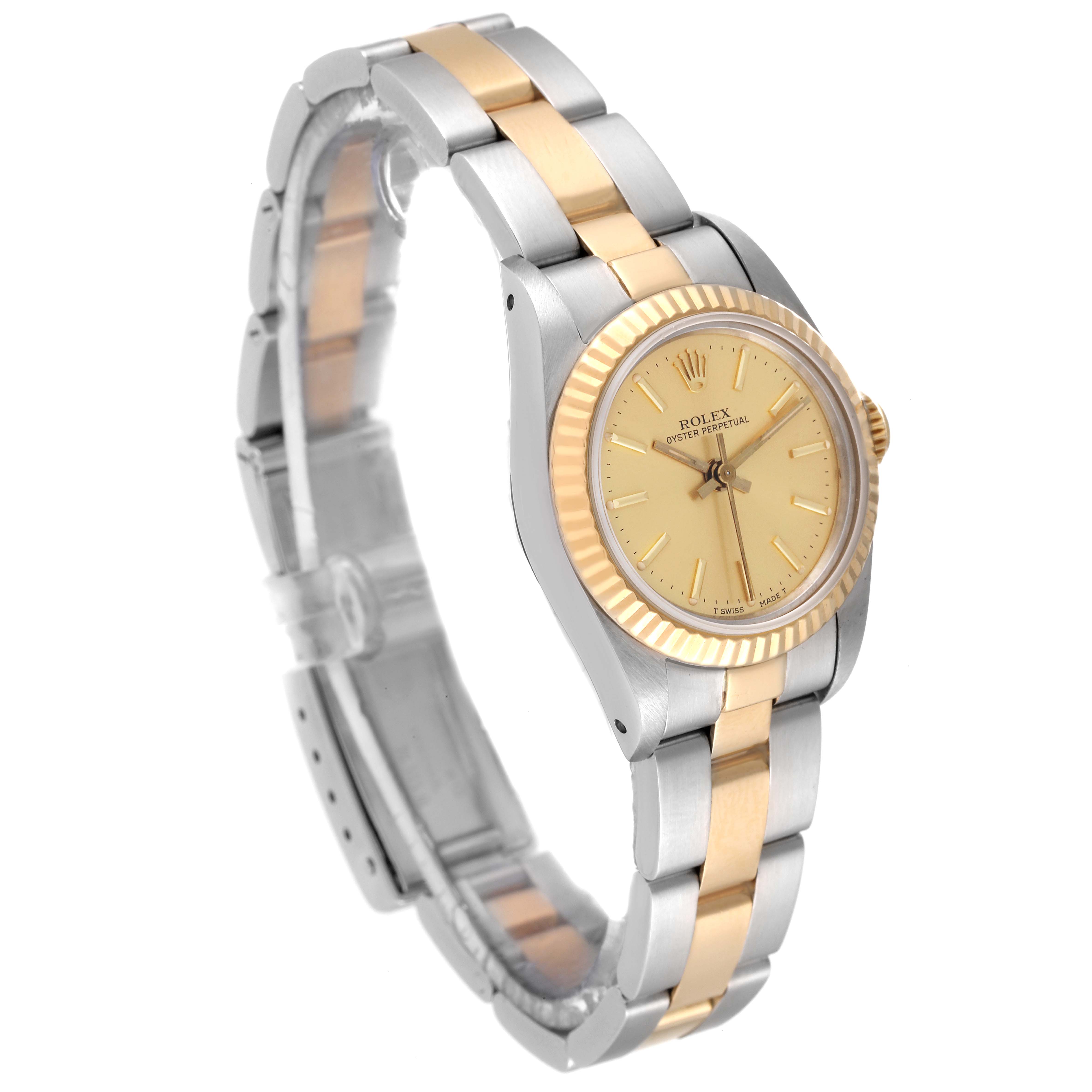 The image shows a Rolex Oyster Perpetual 67193 Women's Steel and Gold (two tone) Champagne Dial 67193 Women's Steel and Gold (two tone) Champagne Dial watch from a front-side angle, highlighting its two-tone gold and silver bracelet.