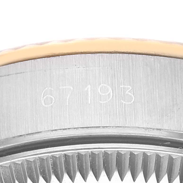This image shows a close-up view of the case and bezel of a Rolex Oyster Perpetual 67193 Women's Steel and Gold (two tone) Champagne Dial 67193 Women's Steel and Gold (two tone) Champagne Dial watch, highlighting the model number "67193".
