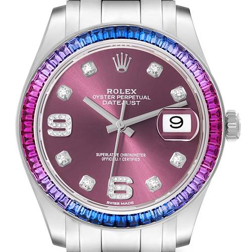 The Rolex Pearlmaster watch is shown from the front, displaying its colorful bezel, pink dial, date window, and diamond hour markers.