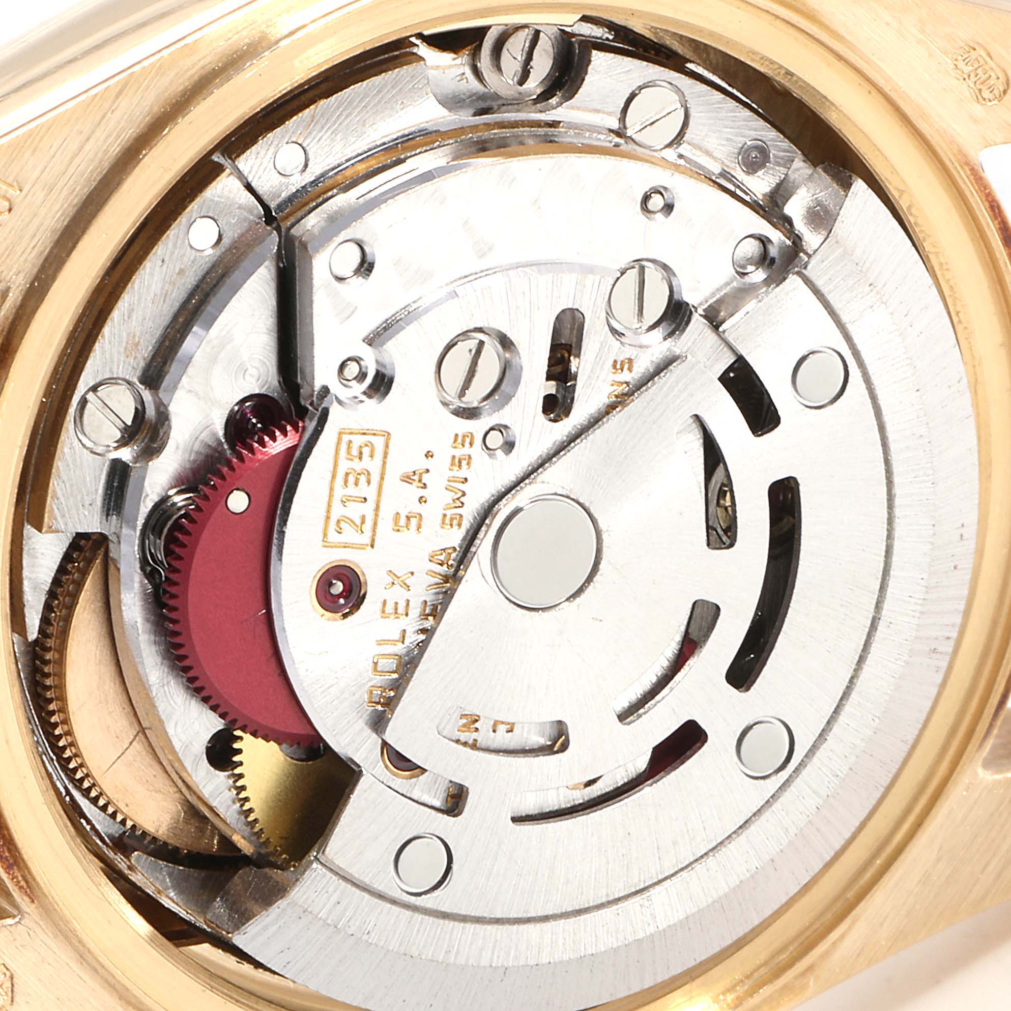 The image shows the inner mechanical movement of a Rolex President 69178 Women's Yellow Gold Mother of Pearl Dial 69178 Women's Yellow Gold Mother of Pearl Dial model watch with visible gears and components.