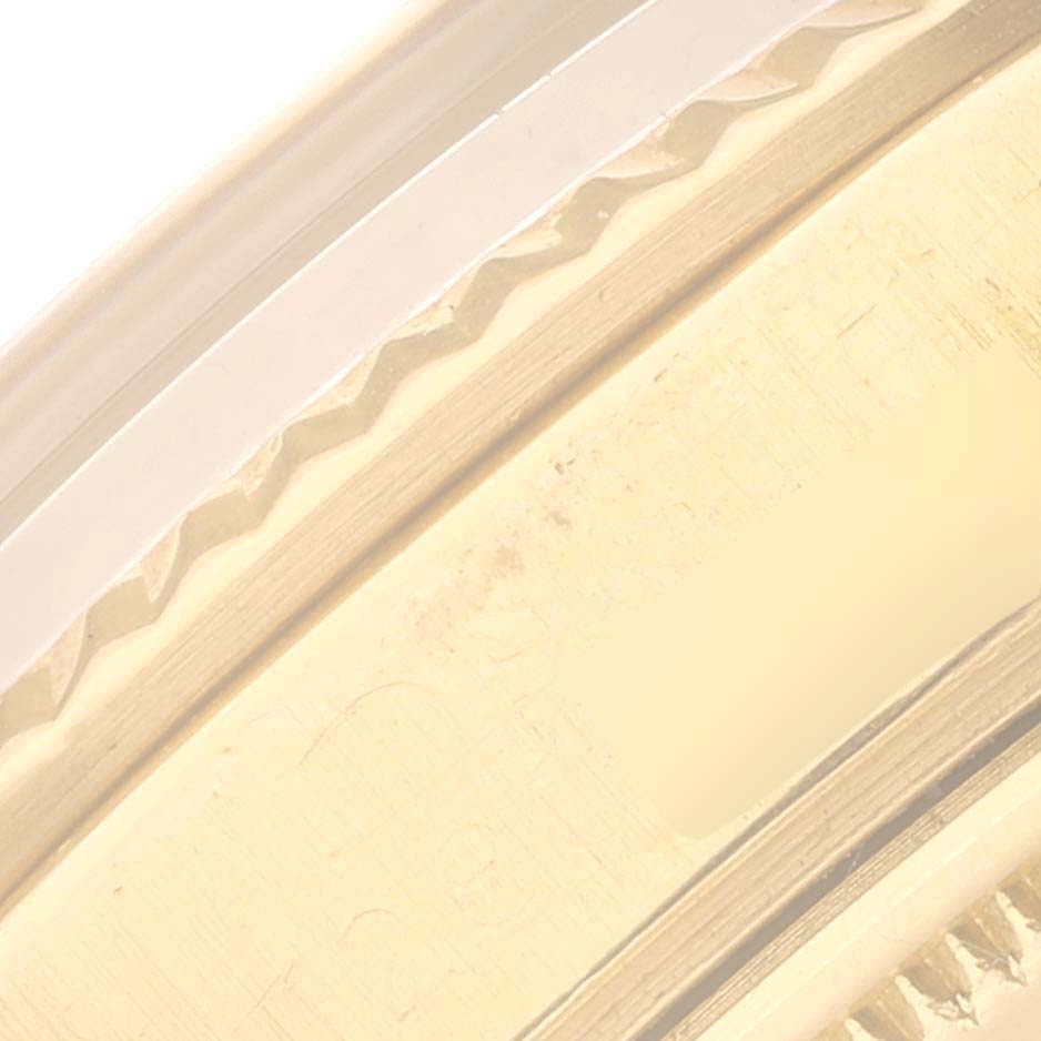 The image shows a close-up of the bezel and part of the case from a Rolex Vintage Collection 1803 Men's Yellow Gold Champagne Dial 1803 Men's Yellow Gold Champagne Dial watch.