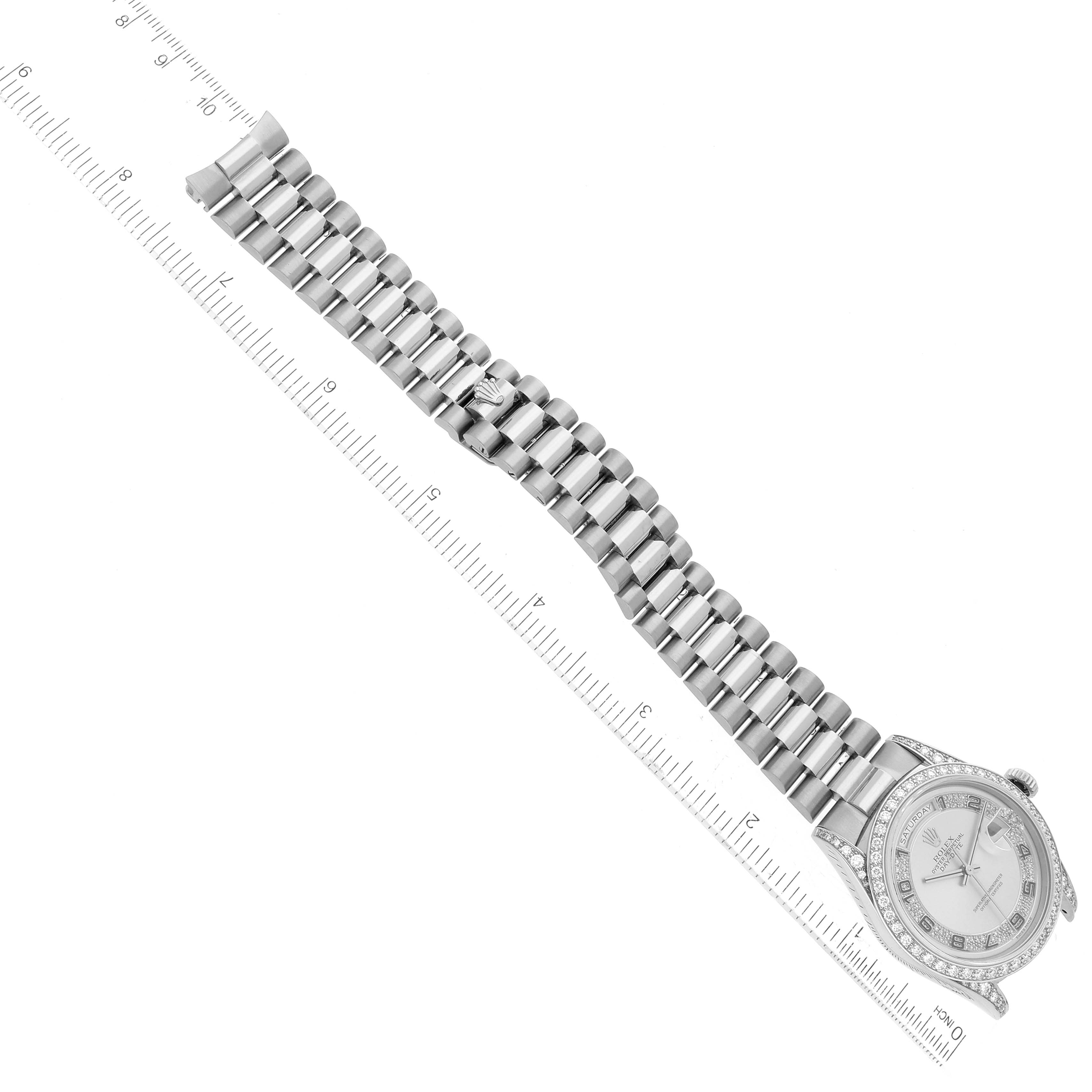 The image shows a Rolex President 18389MG Men's White Gold Silver Dial 18389MG Men's White Gold Silver Dial model watch laid flat next to a ruler, displaying the full length and bracelet.