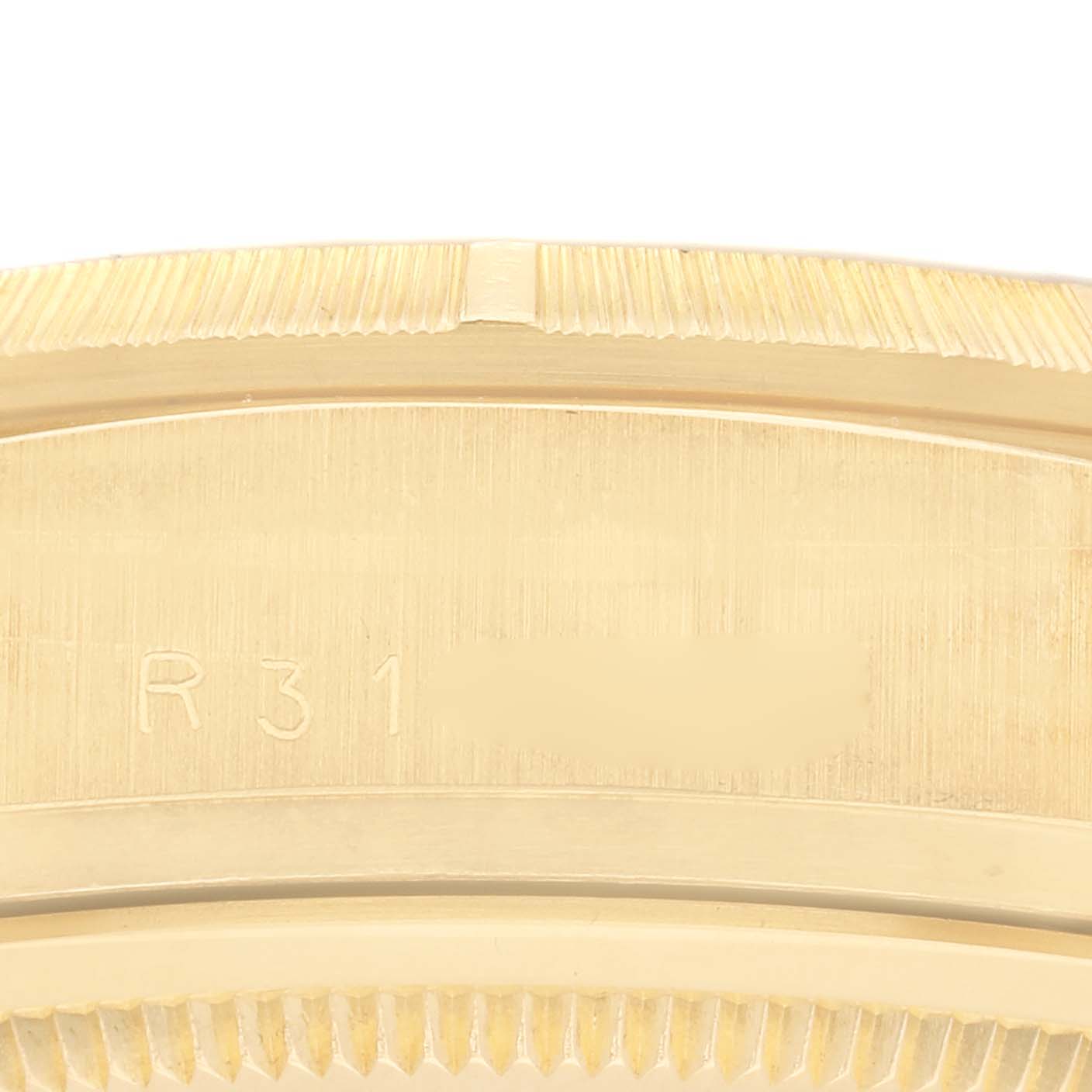 The image shows a close-up of the bezel and part of the case edge of a Rolex President 18078 Men's Yellow Gold Champagne Dial 18078 Men's Yellow Gold Champagne Dial model.