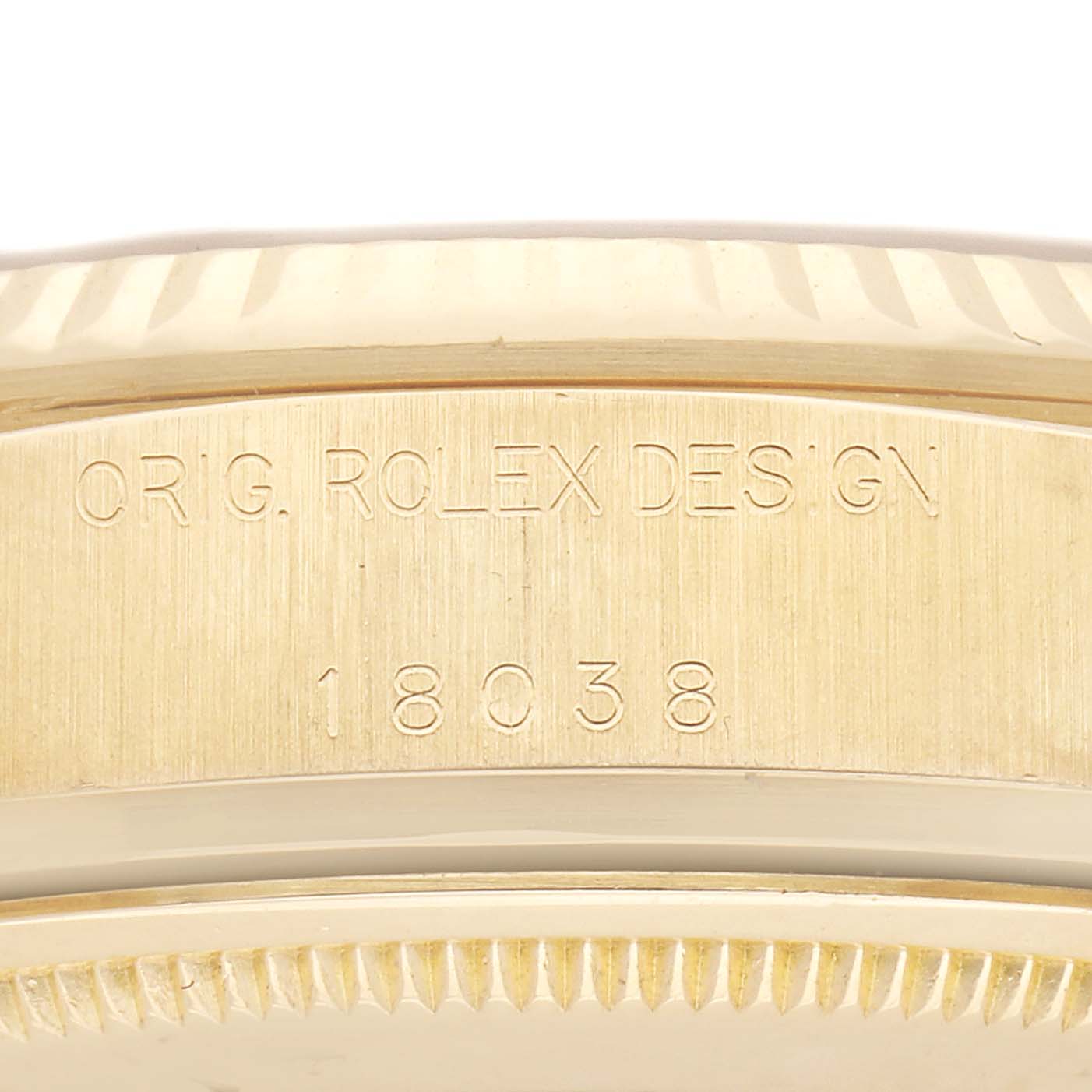 The image shows the side view of a Rolex President 18038 Men's Yellow Gold Champagne Dial 18038 Men's Yellow Gold Champagne Dial model, highlighting its engraved design and model number on the case.