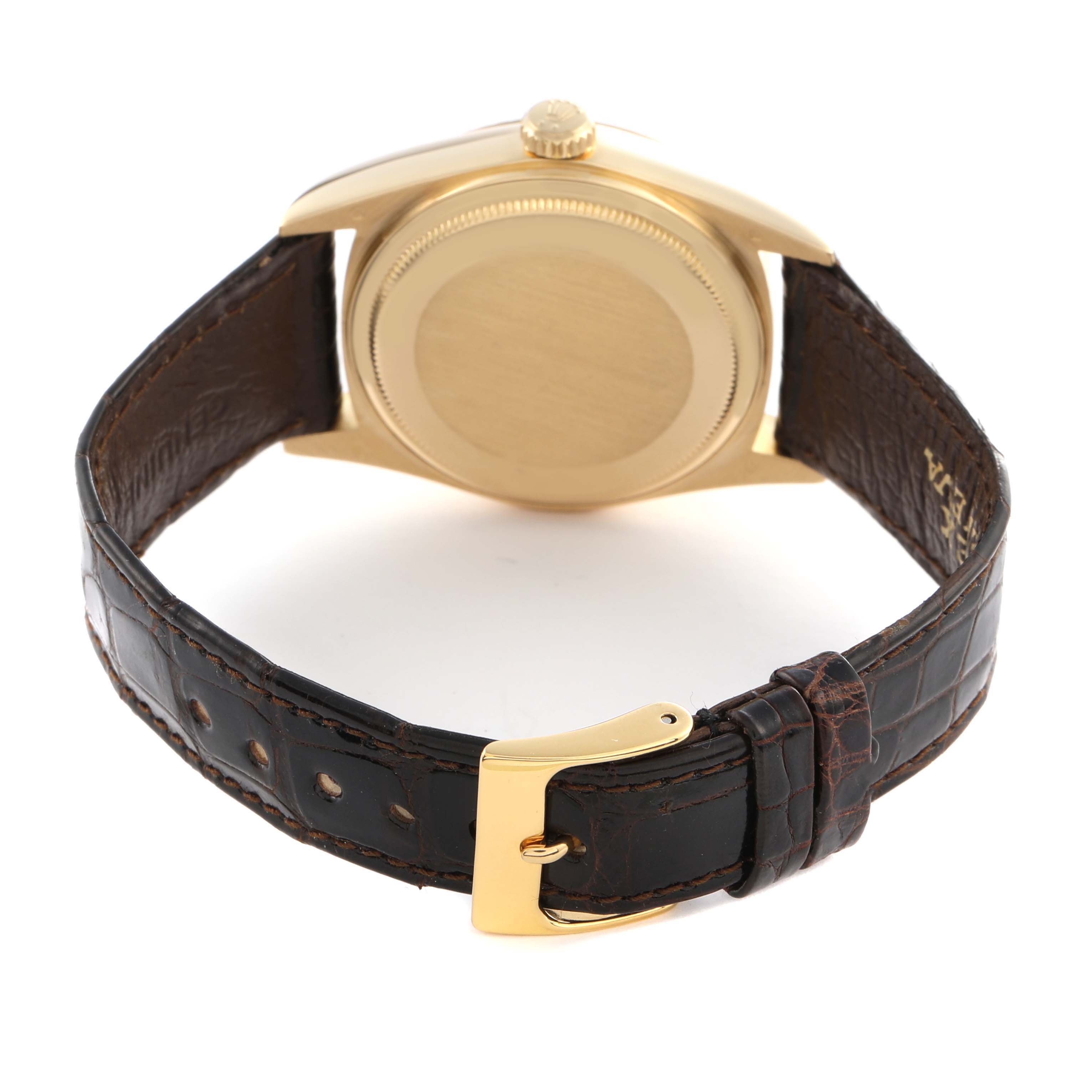 The Rolex President 18038 Men's Yellow Gold Champagne Dial 18038 Men's Yellow Gold Champagne Dial model is shown from the back, highlighting the gold case, crown, and brown leather strap with a gold buckle.