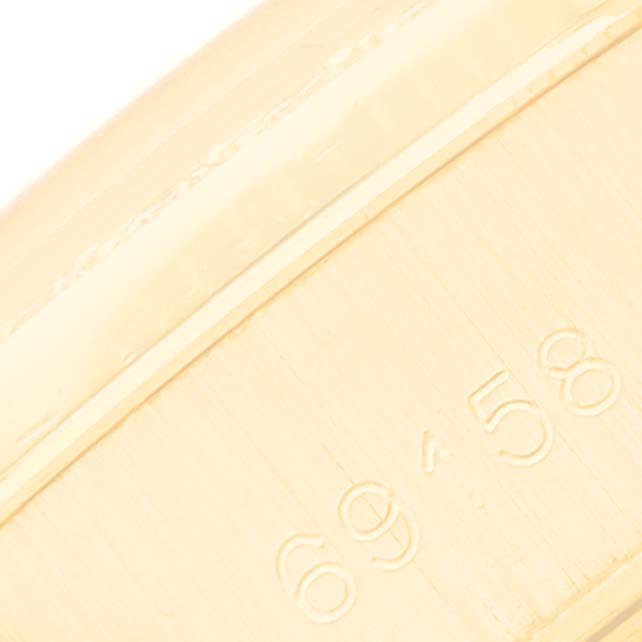 Close-up of the side of the Rolex President 69158 Women's Yellow Gold Champagne Dial 69158 Women's Yellow Gold Champagne Dial model watch, showing engraved numbers.