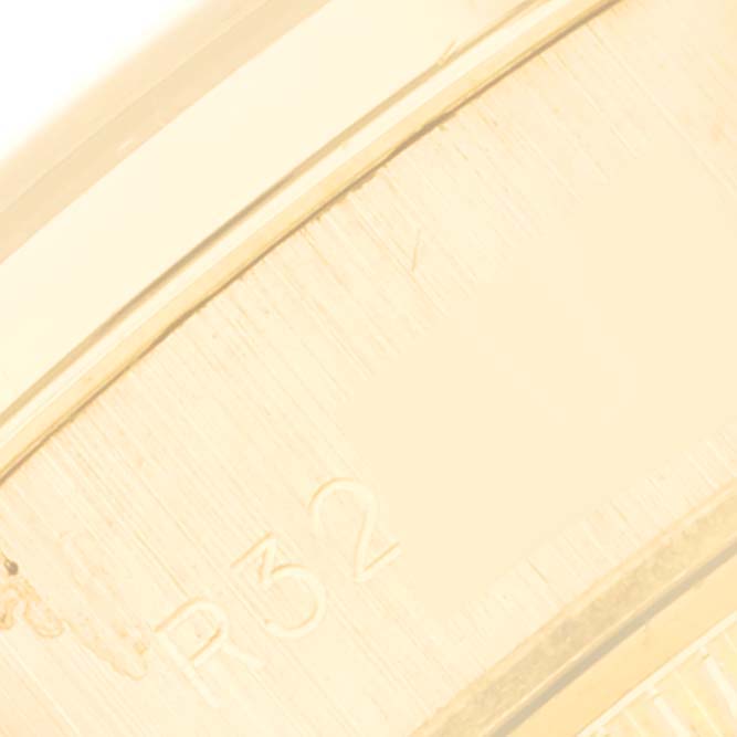 This close-up image shows part of the inner bezel with engraved numbering of a Rolex President 69158 Women's Yellow Gold Champagne Dial 69158 Women's Yellow Gold Champagne Dial model watch.