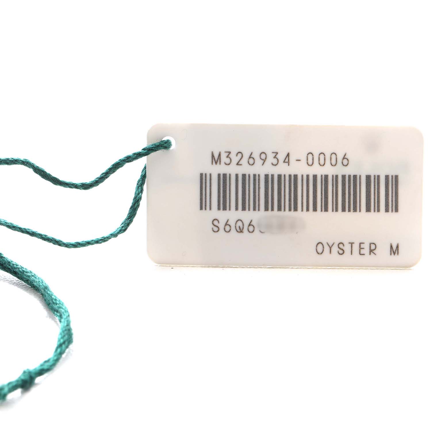 This image shows a close-up of a Rolex Sky-Dweller 326934 Men's Stainless Steel Black Dial's tag with a model number and a barcode.