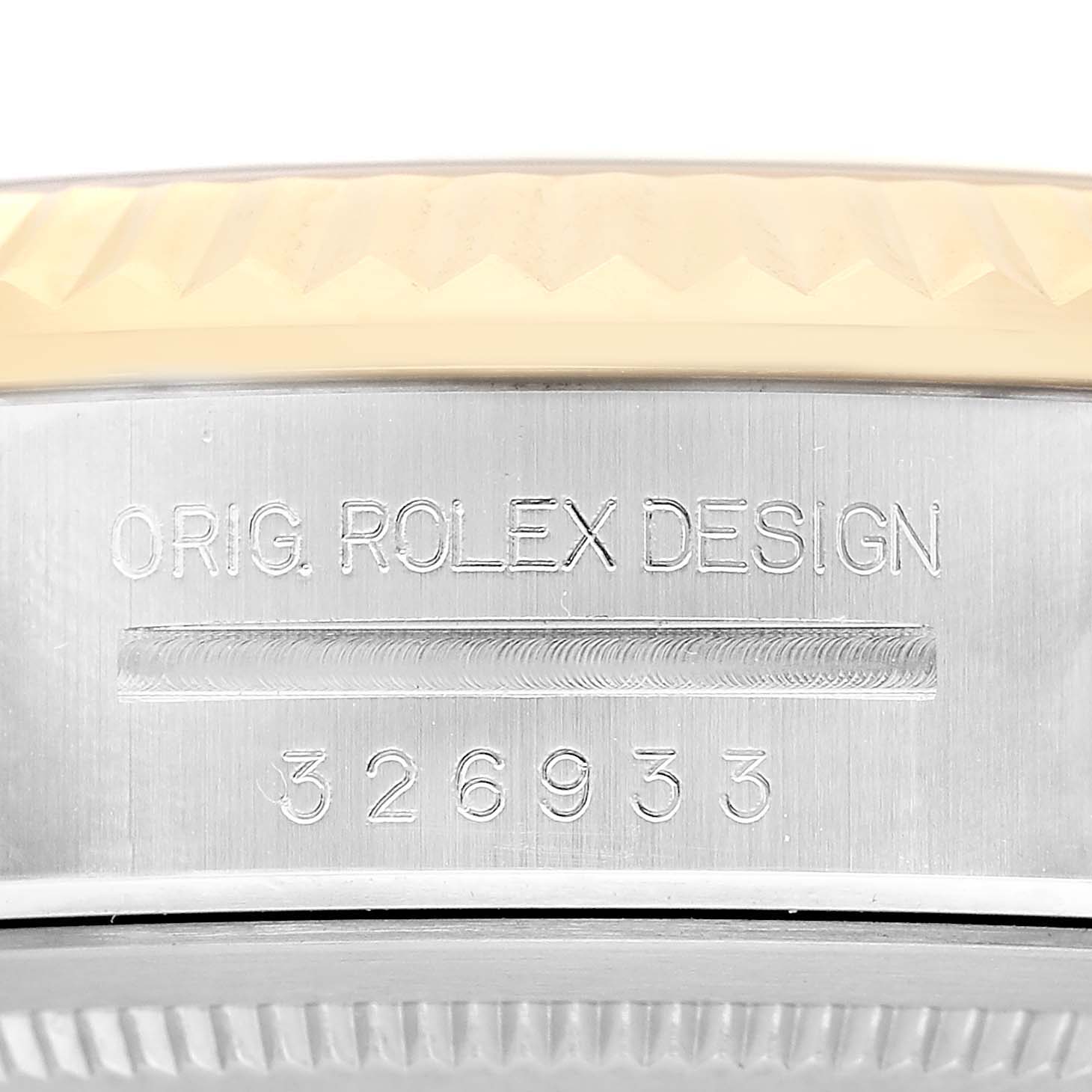 The image shows a close-up of the side of a Rolex Sky-Dweller 326933 Men's Steel and Gold (two tone) Black Dial, highlighting the engraved model number and "ORIG. ROLEX DESIGN".