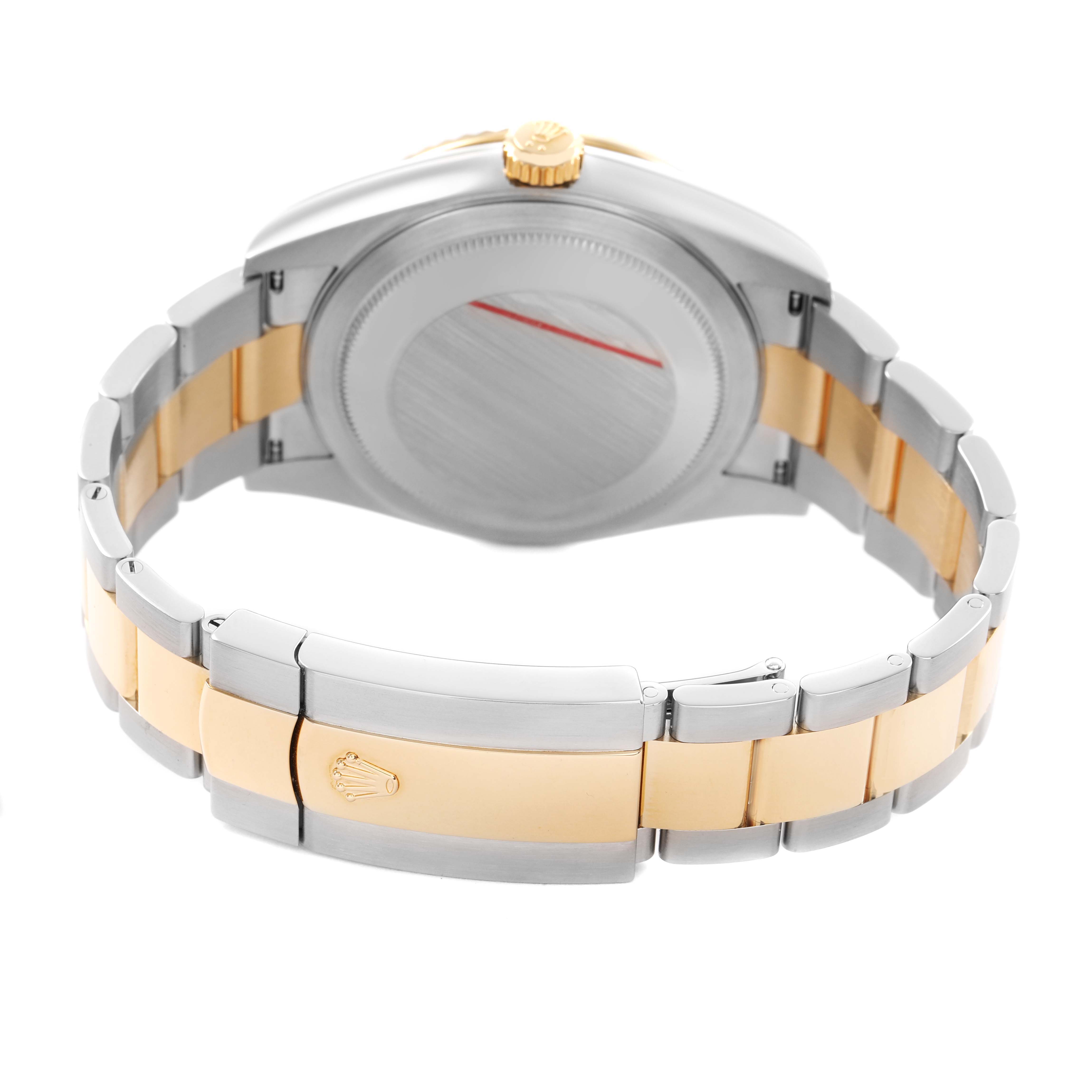 The Rolex Sky-Dweller 326933 Men's Steel and Gold (two tone) Black Dial watch is shown from the back, displaying its two-tone bracelet and case back.