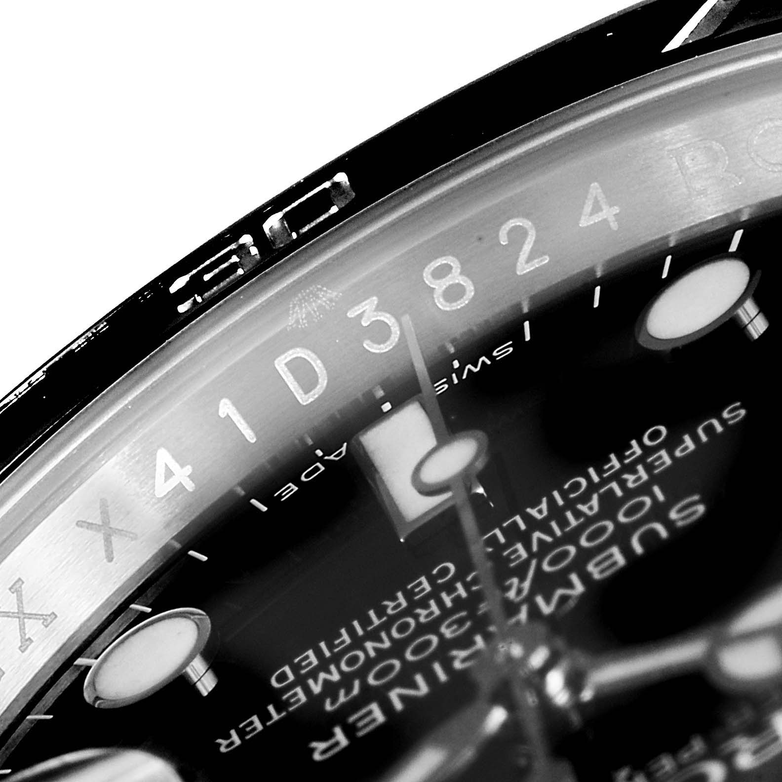 This close-up angle of the Rolex Submariner 116610 Men
s Stainless Steel Black Dial 116610 Men
s Stainless Steel Black Dial model shows the dial, hands, and part of the bezel with serial and model inscriptions.
