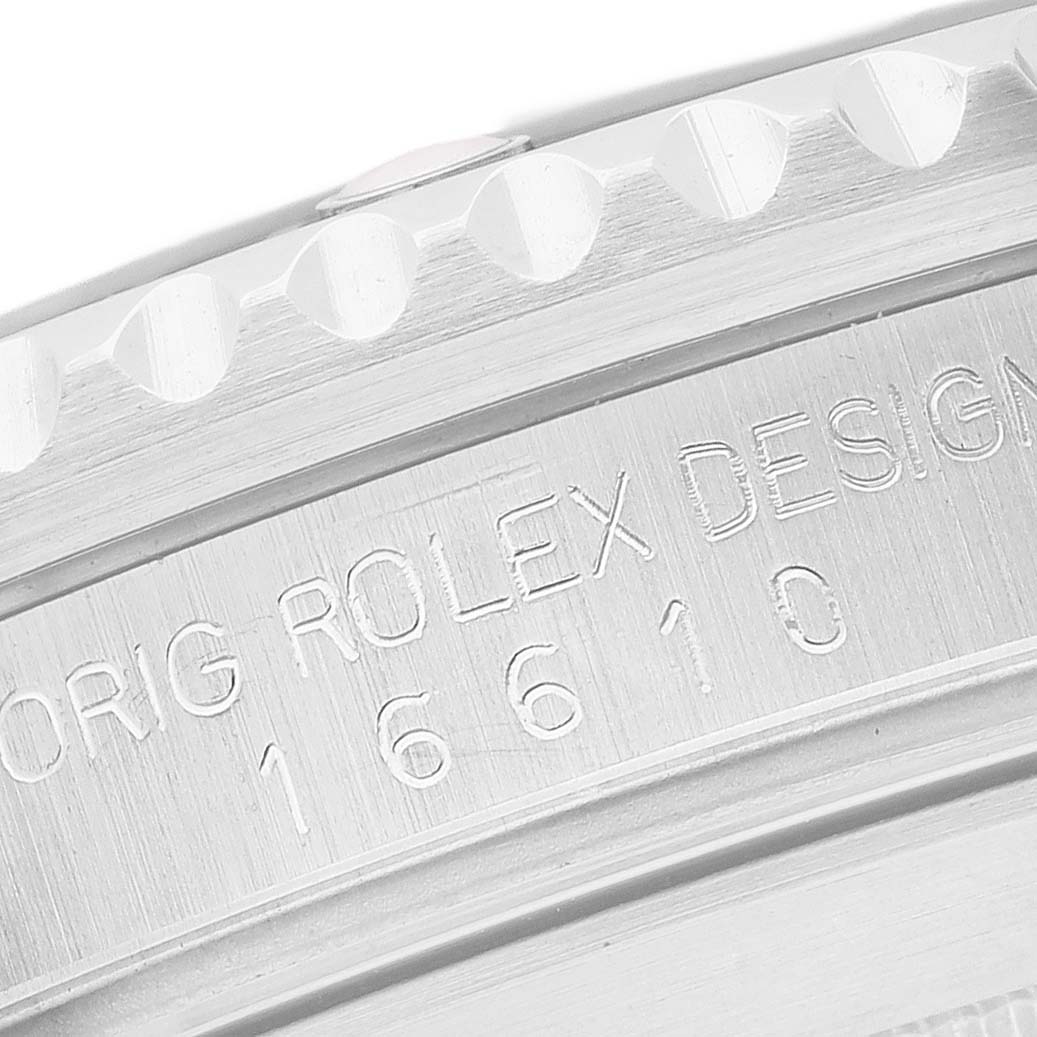 The image shows the side view of a Rolex Submariner 16610 Men's Stainless Steel Black Dial, focusing on the engraved model number and serial number area.