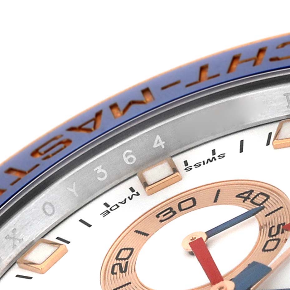 This close-up shows the bezel, part of the dial, and markers of the Rolex Yacht-Master 116681 Men's Steel and Gold (two tone) White Dial 116681 Men's Steel and Gold (two tone) White Dial watch.