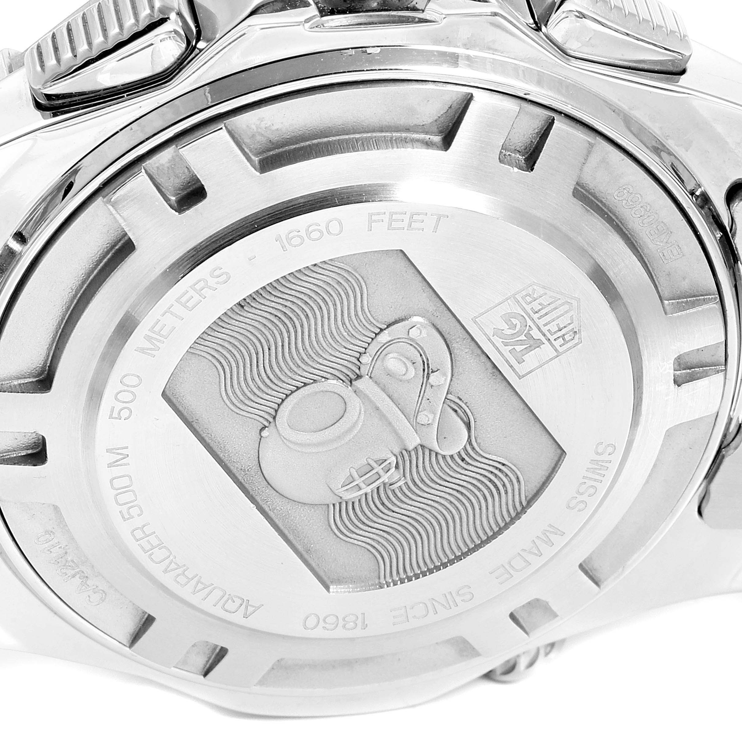 The image shows the case back of a Tag Heuer Aquaracer CAJ2110.BA0872 Men
s Stainless Steel Black Dial CAJ2110.BA0872 Men
s Stainless Steel Black Dial watch, engraved with a diving helmet and water wave design.