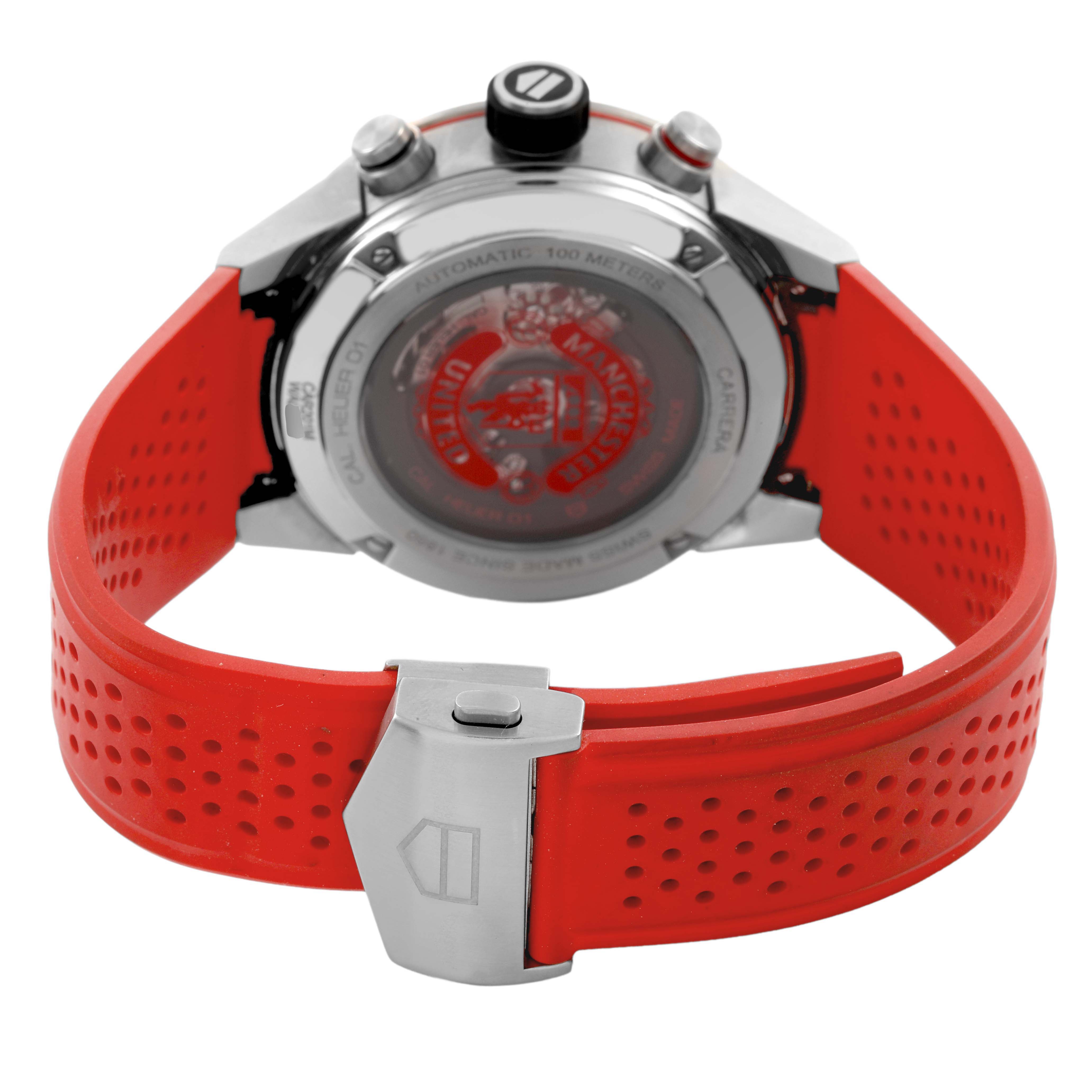 The Tag Heuer Carrera CAR201M Men's Stainless Steel Silver Dial watch is shown from the back, highlighting the case back, crown, and red rubber strap with a clasp.