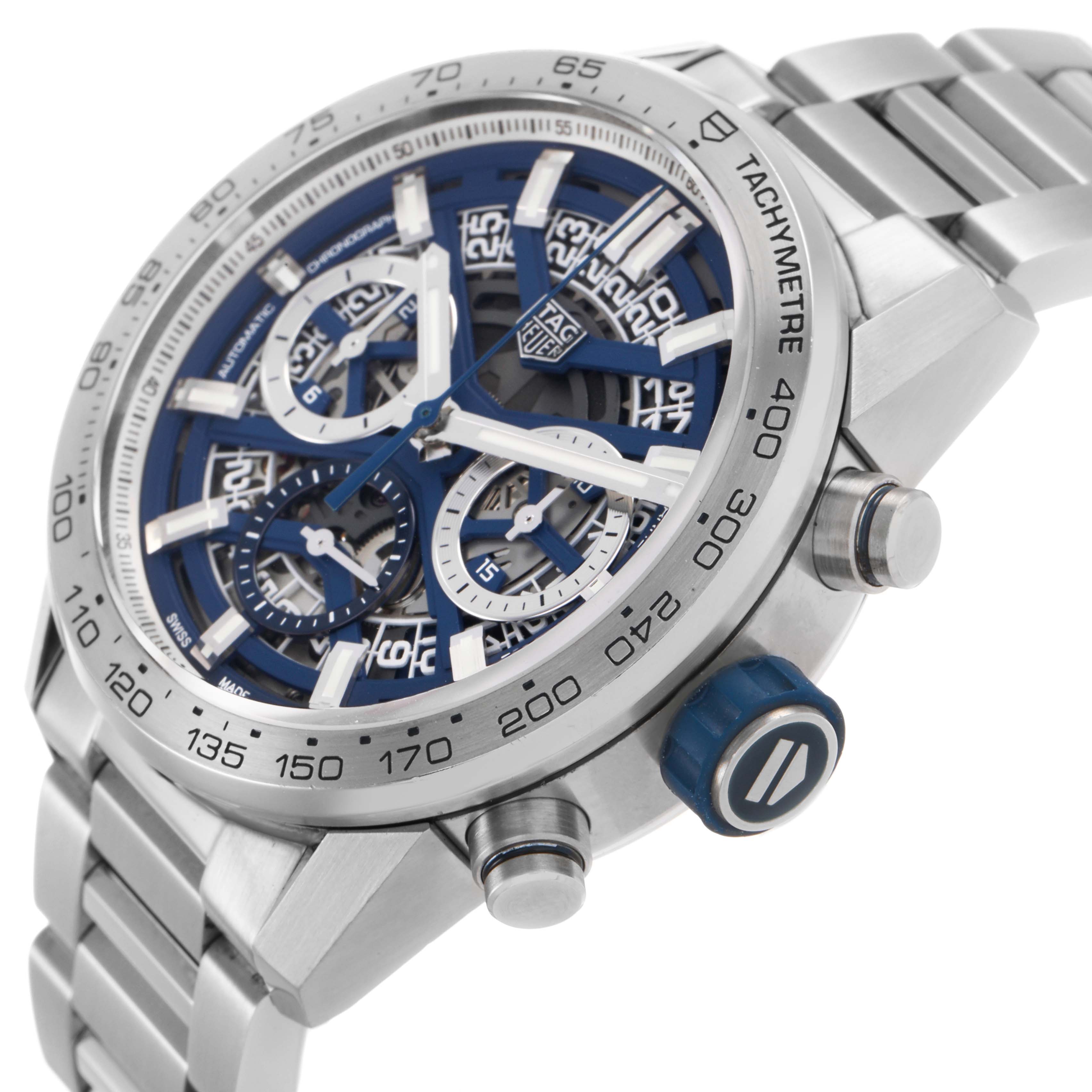 The Tag Heuer Carrera CBG2019.BA0662 Men's Stainless Steel Blue Dial watch is shown at an angled side view, highlighting the dial, bezel, crown, and part of the bracelet.