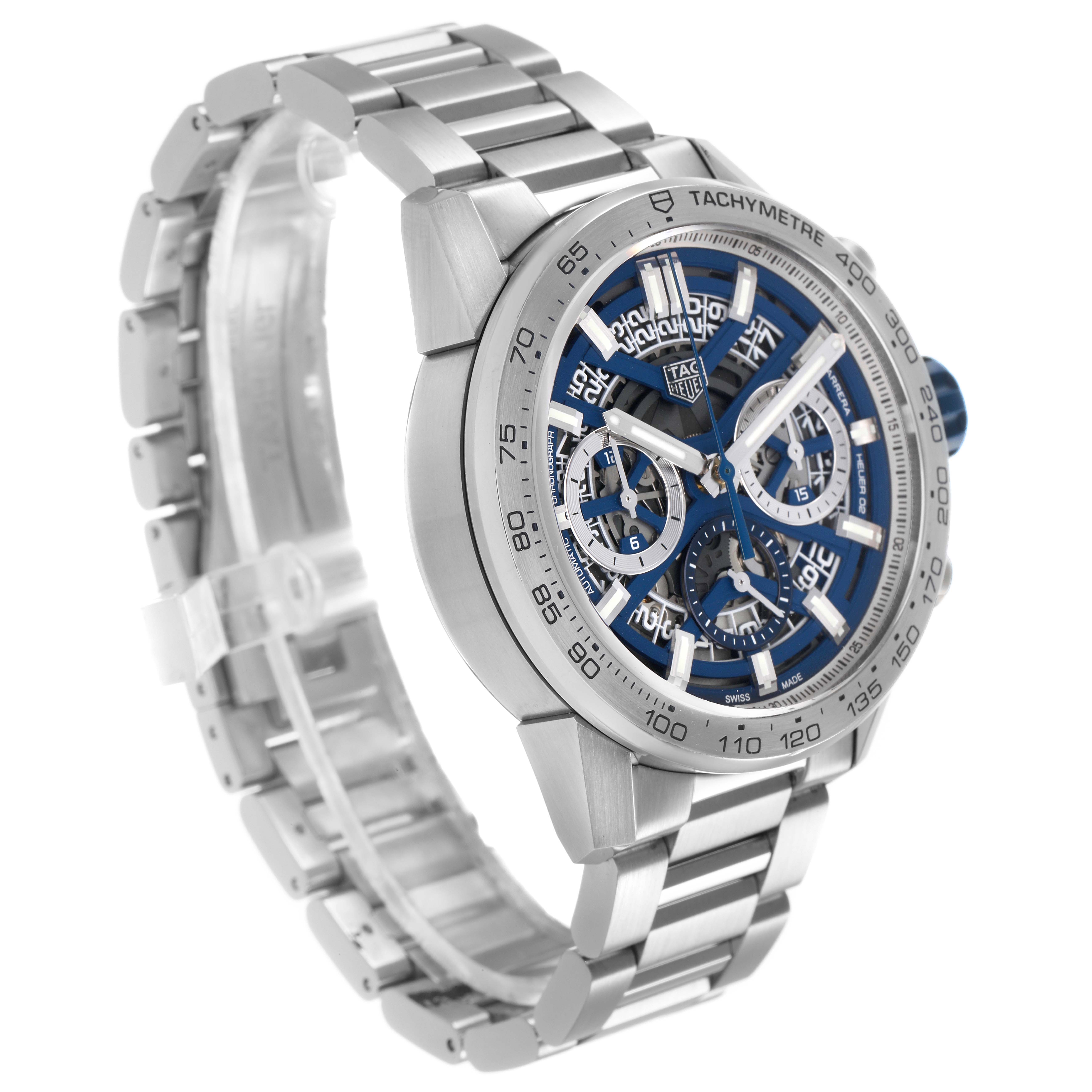 The Tag Heuer Carrera CBG2019.BA0662 Men's Stainless Steel Blue Dial watch is shown at a three-quarter angle, highlighting the face, tachymeter bezel, and metal bracelet.