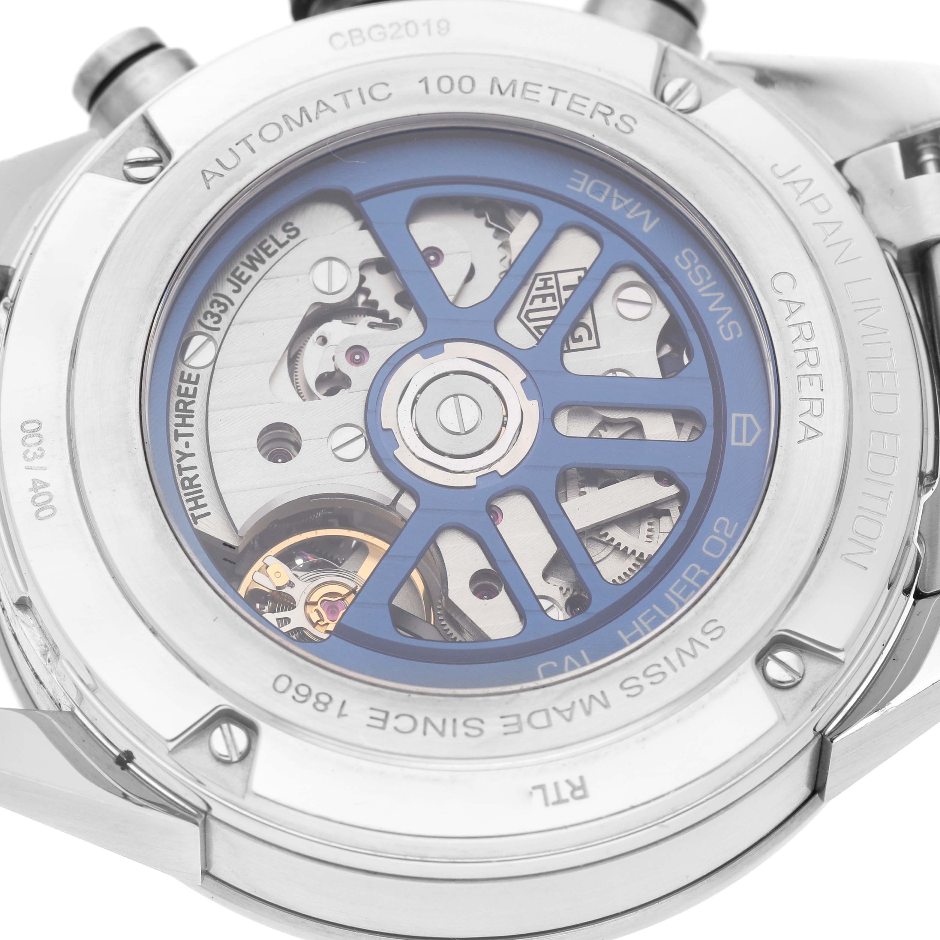 The image shows the back of a Tag Heuer Carrera CBG2019.BA0662 Men's Stainless Steel Blue Dial watch, revealing its mechanical movement and "Japan Limited Edition" marking.
