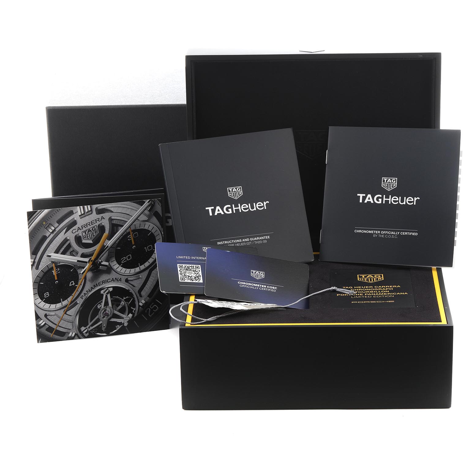 The image shows a Tag Heuer Limited Edition CBS5012.FC6571 Men
s Stainless Steel Silver Dial CBS5012.FC6571 Men
s Stainless Steel Silver Dial watch box, manuals, warranty cards, and a watch face image displayed at an angle.