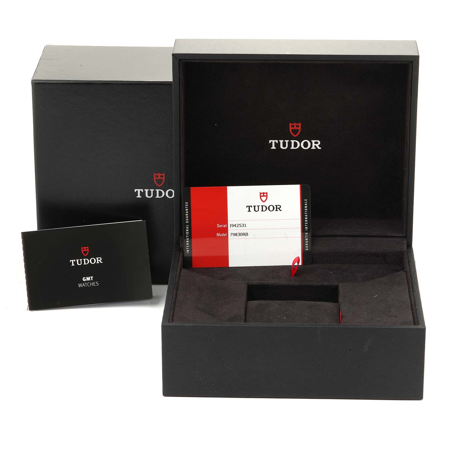 The image shows the packaging and certification card for the Heritage Black Bay model by Tudor from a front angle.