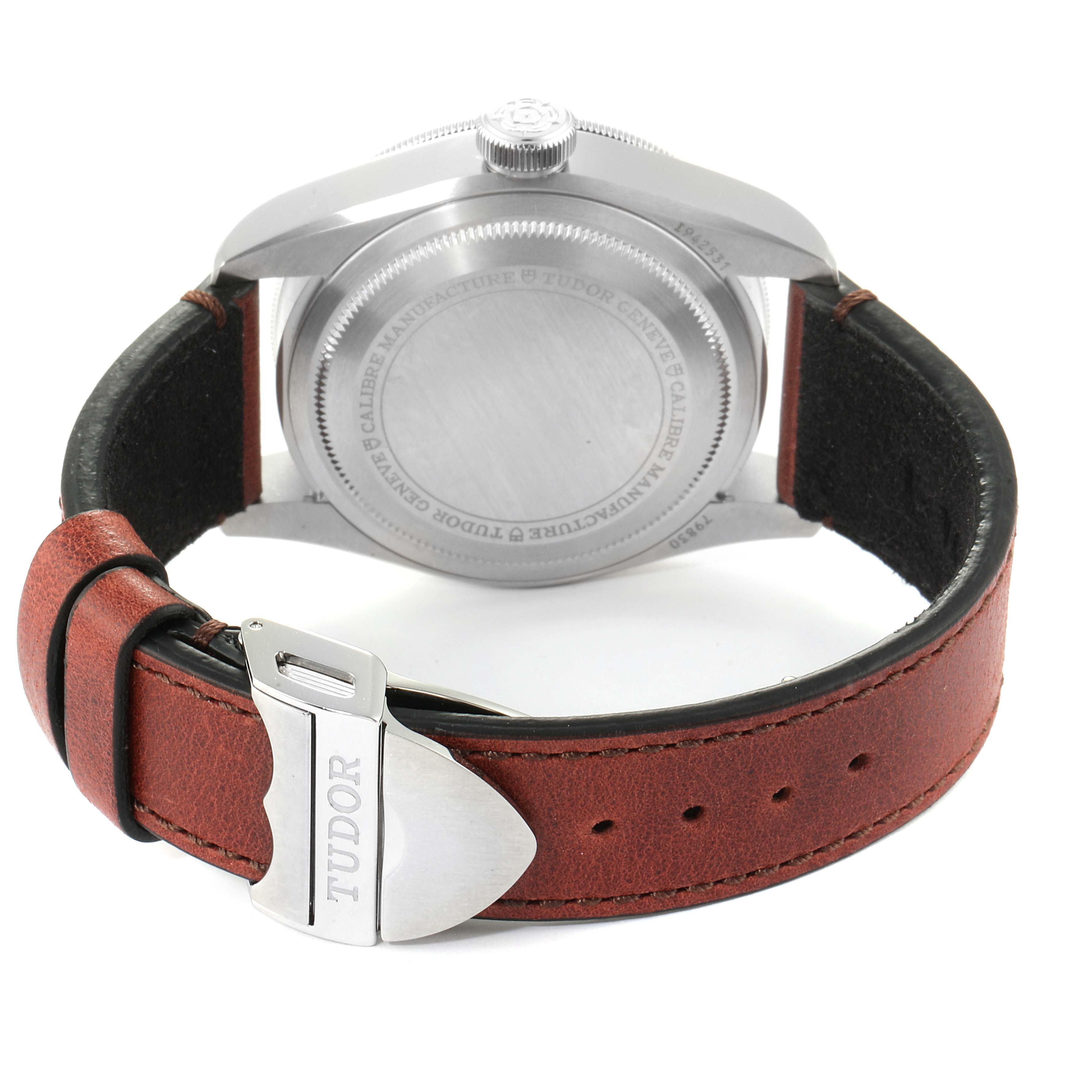 The image shows the back view of a Tudor Heritage Black Bay 79830RB Men
s Stainless Steel Black Dial 79830RB Men
s Stainless Steel Black Dial watch, highlighting its case back, crown, and leather strap with buckle.