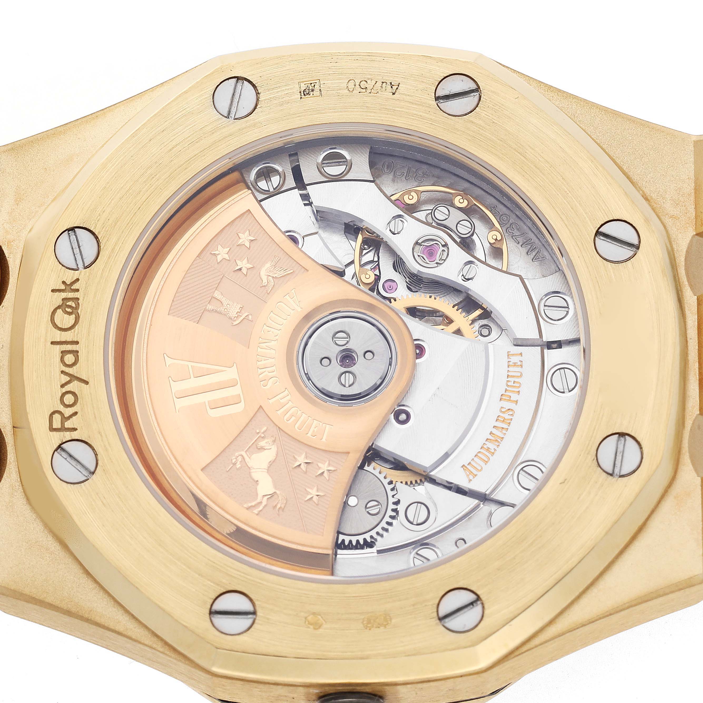 The image shows the back of the Audemars Piguet Royal Oak 15451BA.ZZ.1256BA.01 Men's Yellow Gold Blue Dial 15451BA.ZZ.1256BA.01 Men's Yellow Gold Blue Dial, highlighting the movement and rotor.