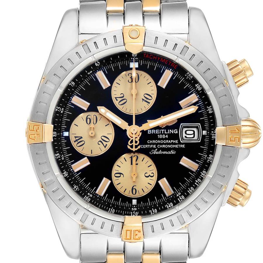 The Breitling Chronomat watch is shown from a front angle, displaying its dial, bezel, crown, and pushers.