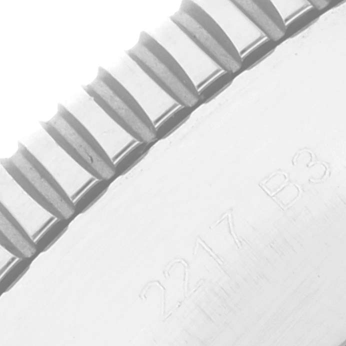 The image shows a close-up angle of the toothed bezel and markings on a Breitling Superocean AB2010 Men's Stainless Steel Beige Dial AB2010 Men's Stainless Steel Beige Dial watch.