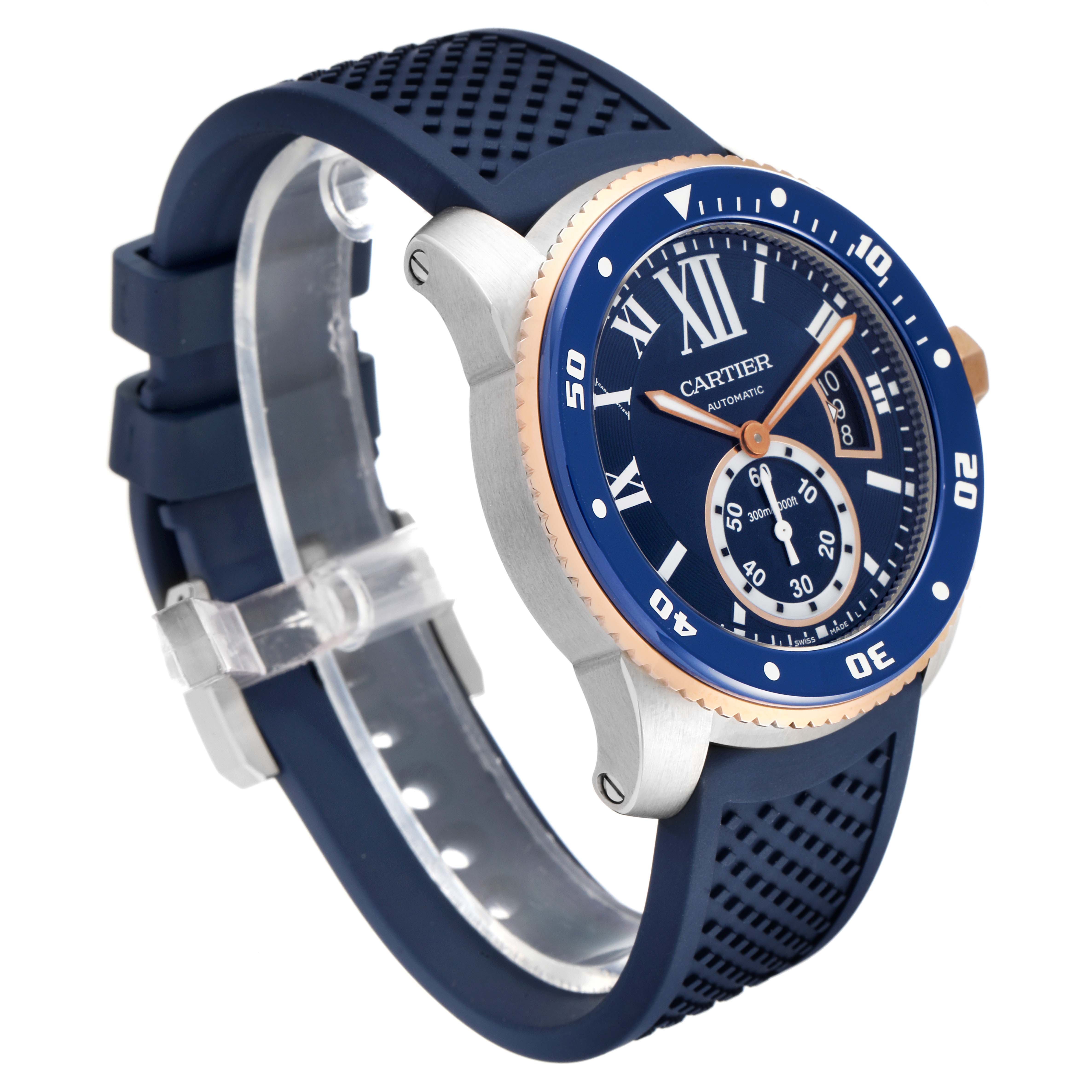 The image shows a side angle of the Calibre de Cartier watch by Cartier, highlighting the blue dial, rubber strap, and bezel.
