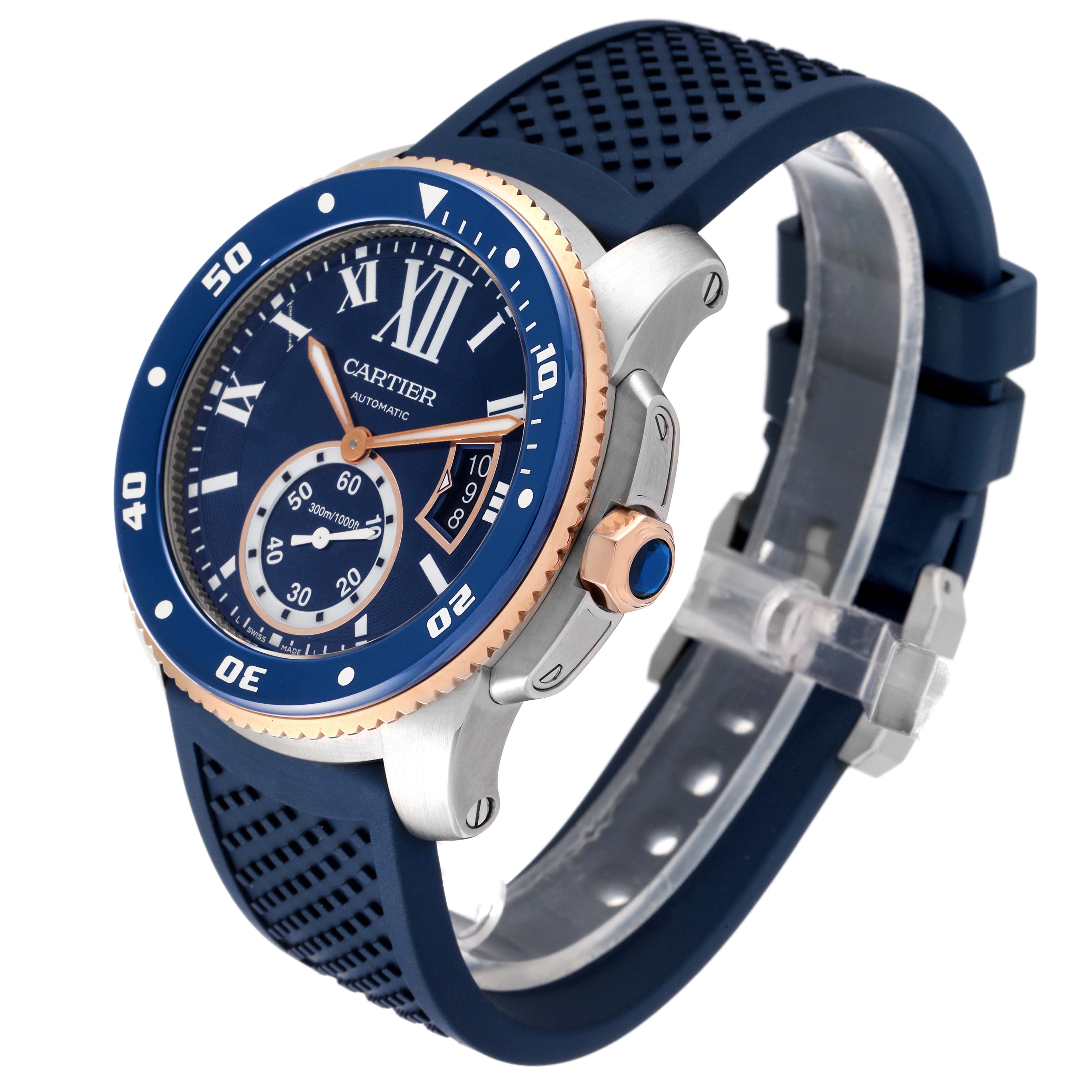 The image shows a side angle of the Calibre de Cartier watch by Cartier, highlighting its blue bezel, dial, and rubber strap.