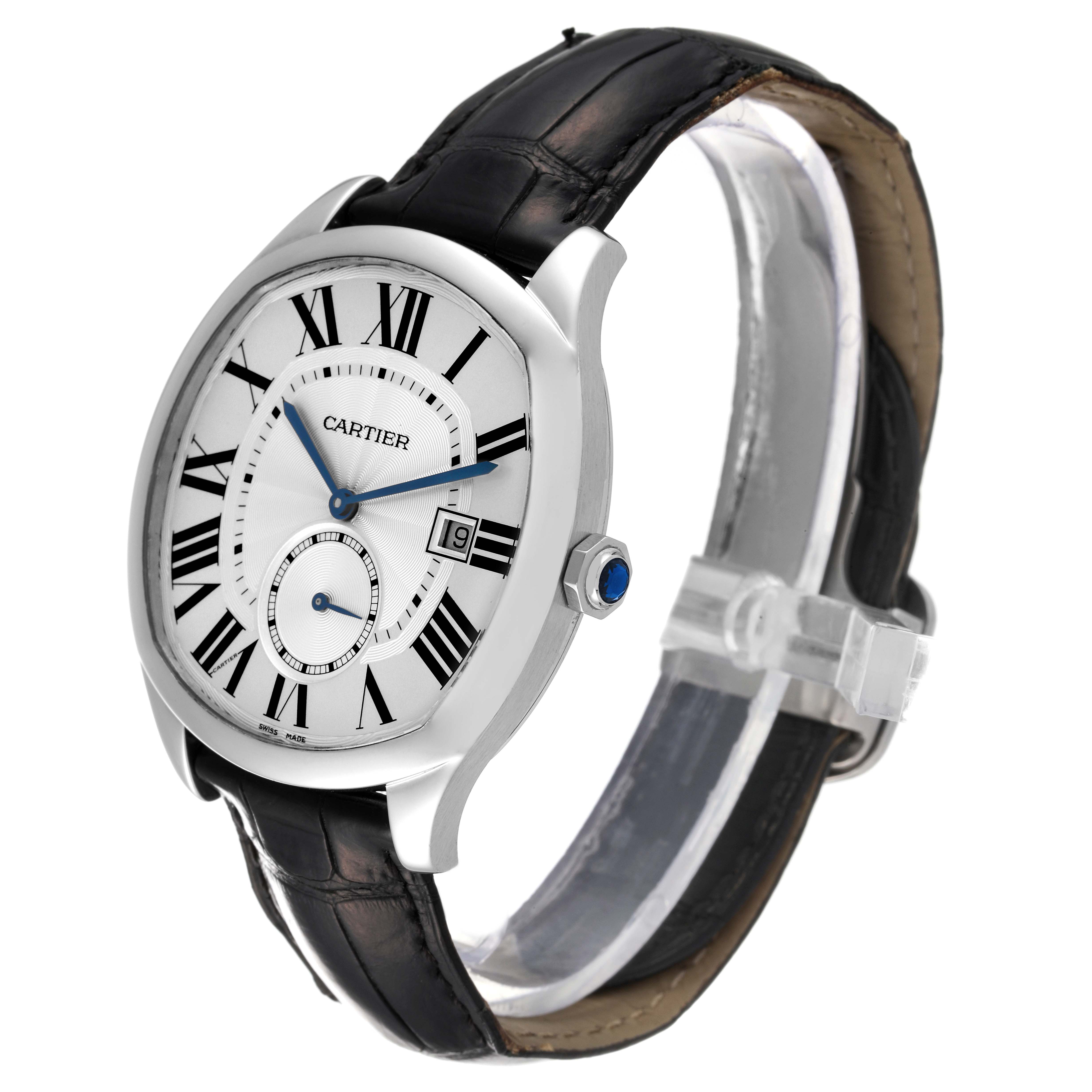 The image shows a Drive de Cartier watch by Cartier from a side angle, highlighting its black strap, silver casing, and white dial with Roman numerals.