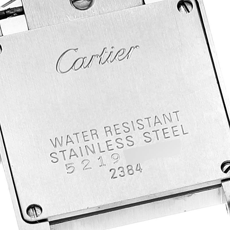 The image shows the back case of a Cartier Tank Francaise W51008Q3 Women's Stainless Steel Silver Dial W51008Q3 Women's Stainless Steel Silver Dial watch, highlighting its water resistance and stainless steel features.