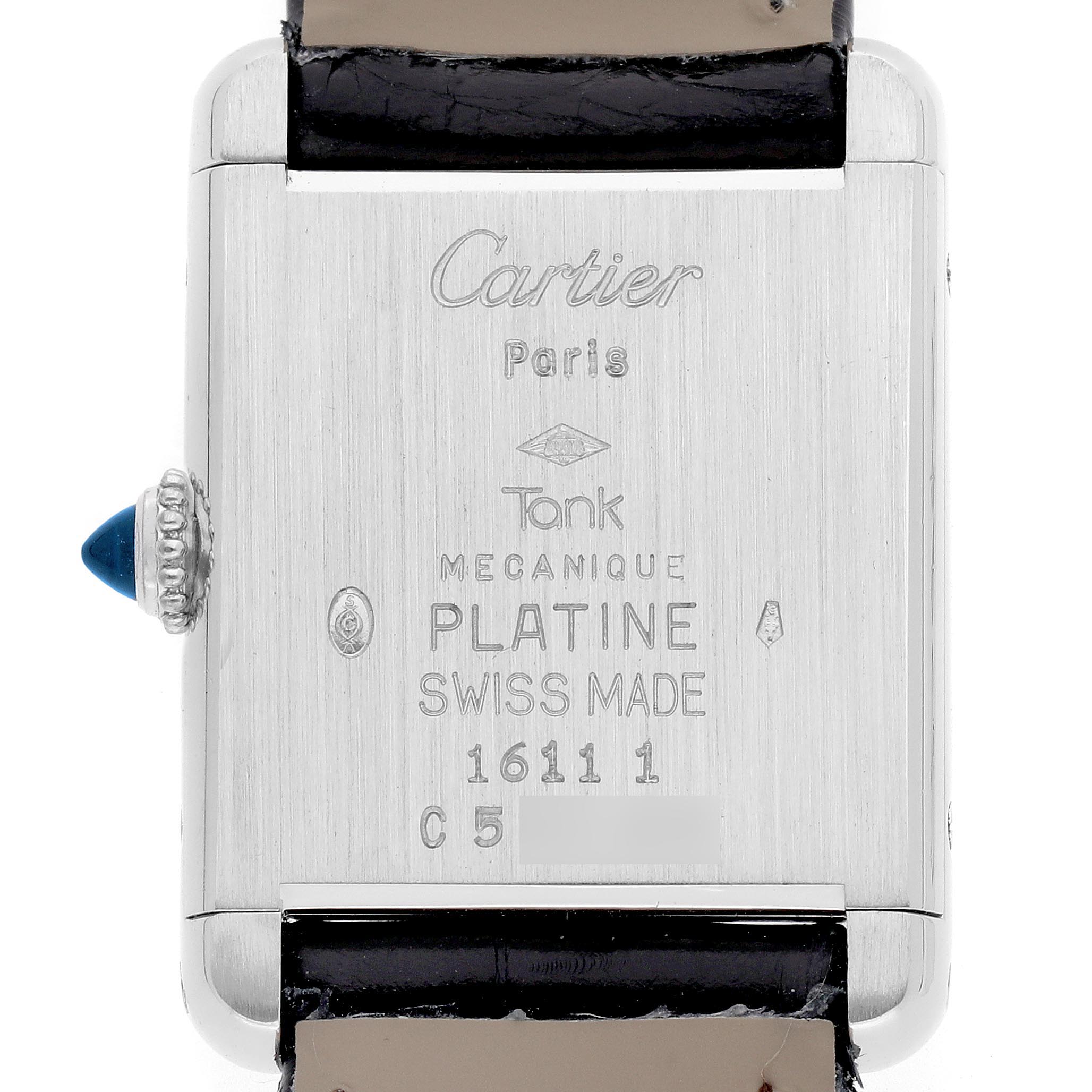 The image shows the back of the Tank Louis watch by Cartier, highlighting engravings and the crown.