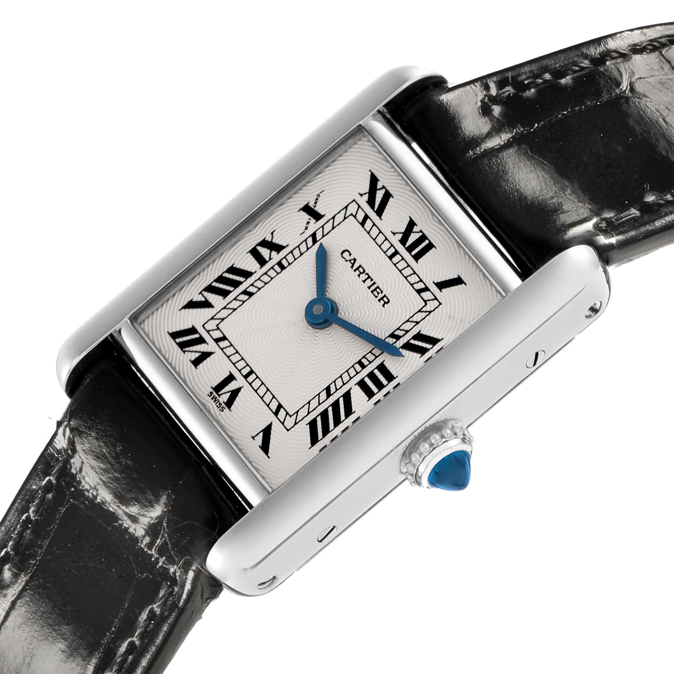 The image shows a Cartier Tank Louis W1509251 Women's Platinum Silver Dial W1509251 Women's Platinum Silver Dial watch at an angle highlighting the face, Roman numerals, blue hands, and crown with a blue cabochon.
