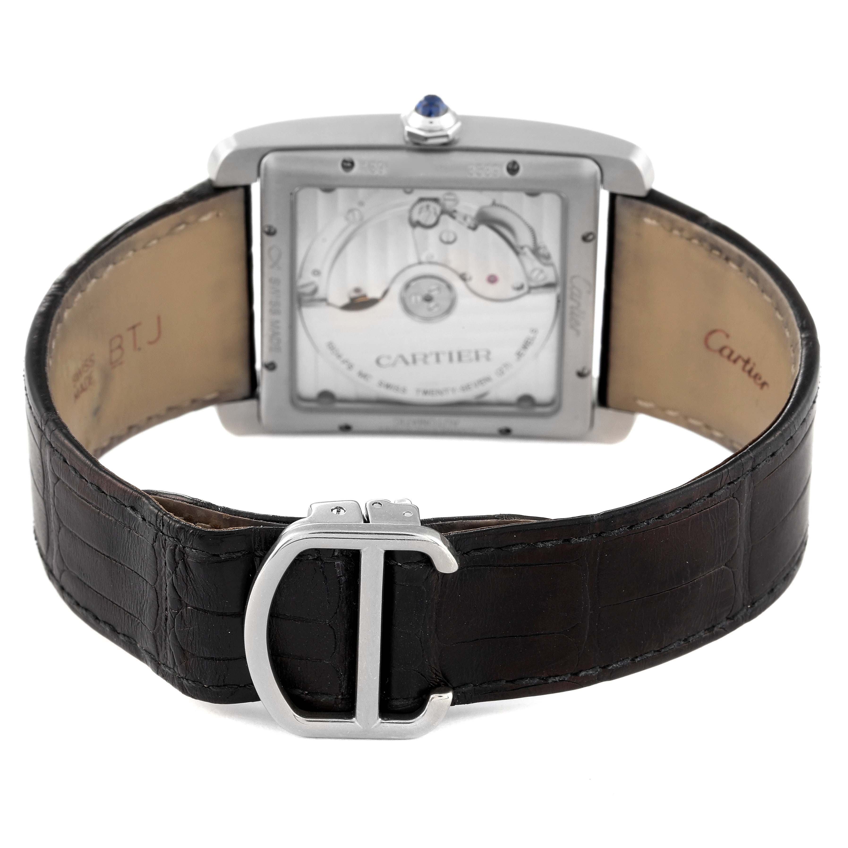 This image shows the back view of the Cartier Tank MC W5330004 Men
s Stainless Steel Black Dial W5330004 Men
s Stainless Steel Black Dial model, highlighting the movement and leather strap with a clasp.