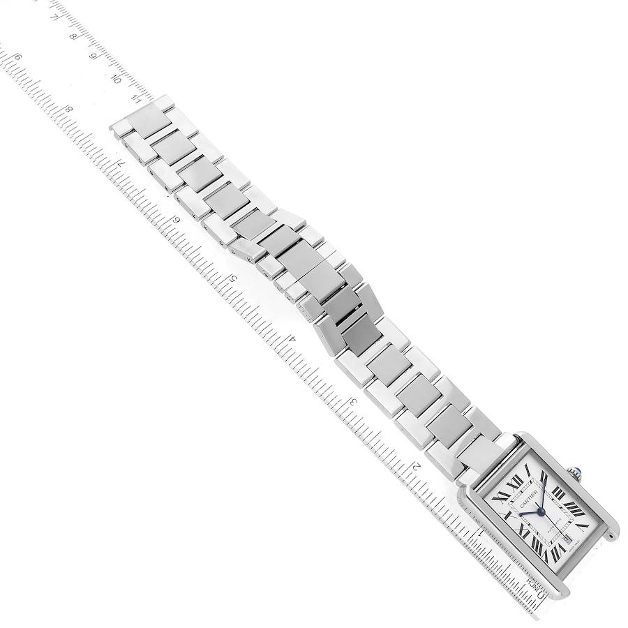 The image shows a Cartier Tank Solo W5200028 Men's Stainless Steel Silver Dial W5200028 Men's Stainless Steel Silver Dial watch at an angle, displaying the face and stainless steel bracelet alongside a ruler for scale.