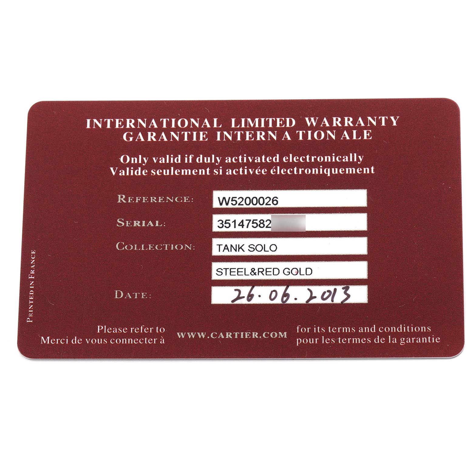 The image shows an international limited warranty card for the Cartier Tank Solo W5200026 Men
s Steel and Gold (two tone) Silver Dial W5200026 Men
s Steel and Gold (two tone) Silver Dial watch model.