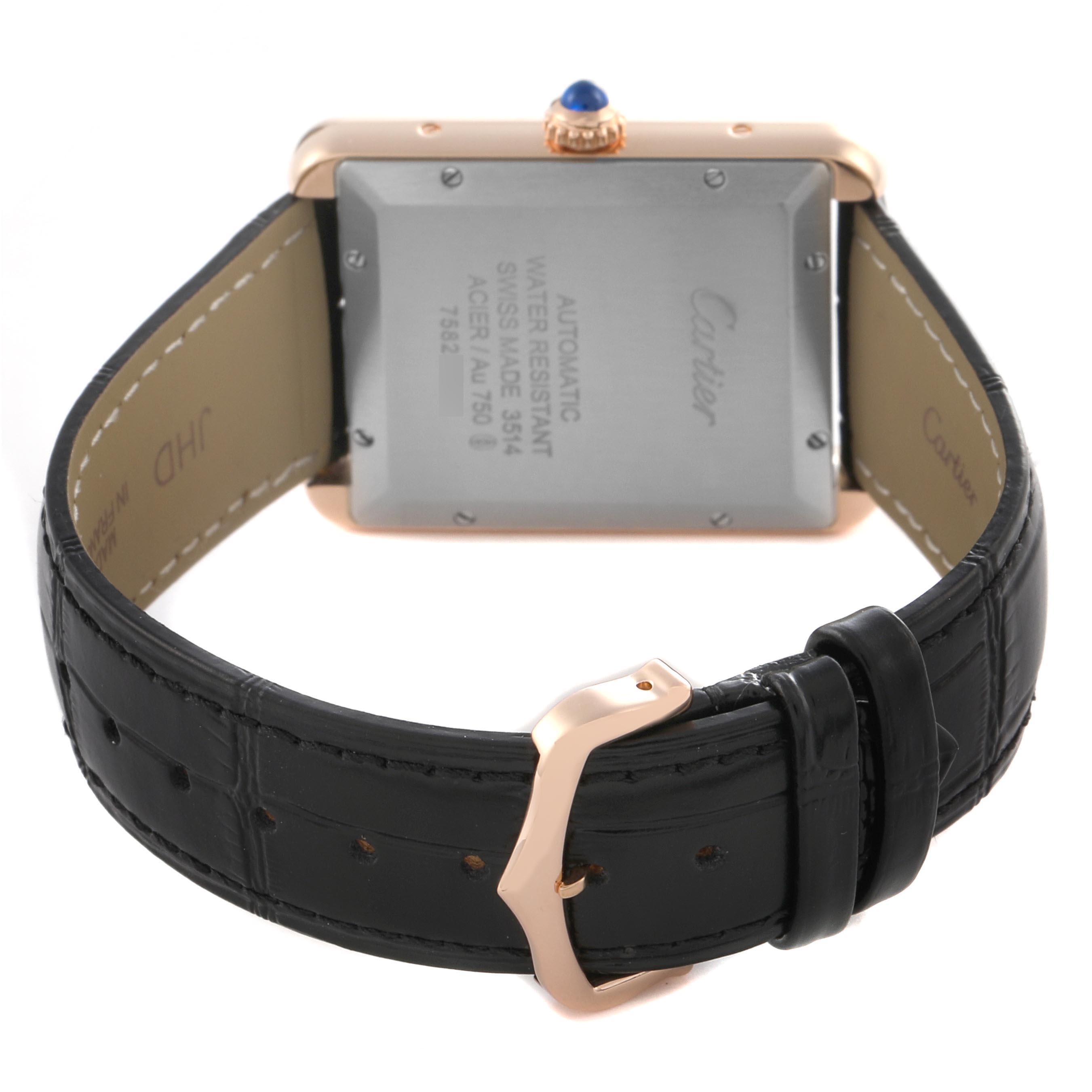 The image shows the back view of a Cartier Tank Solo W5200026 Men
s Steel and Gold (two tone) Silver Dial W5200026 Men
s Steel and Gold (two tone) Silver Dial watch, highlighting its case back, leather strap, and buckle.