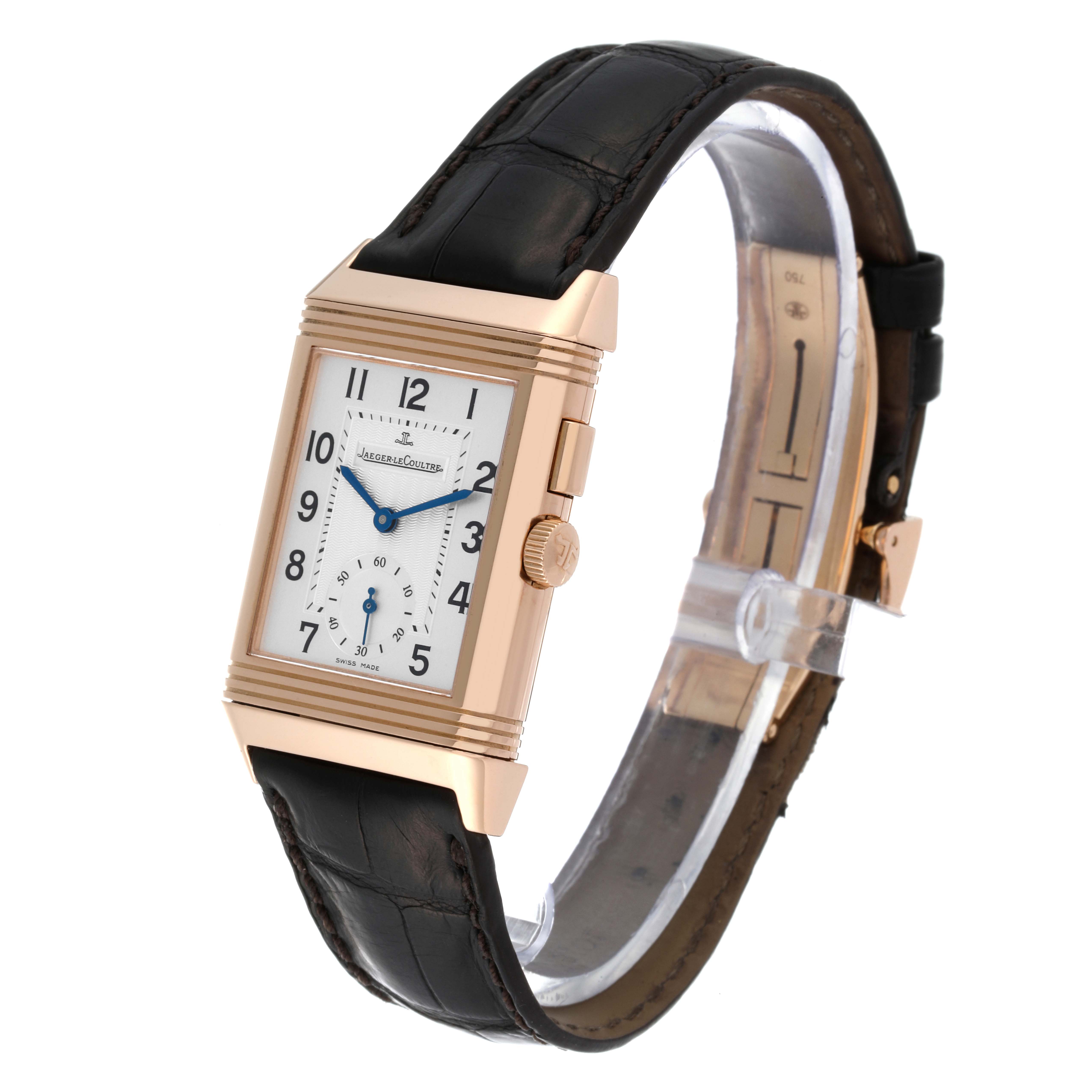 The Jaeger LeCoultre Reverso Q2712410 Men's Rose Gold Silver Dial Q2712410 Men's Rose Gold Silver Dial watch is shown at an angled side view, highlighting the dial, case, crown, and leather strap.