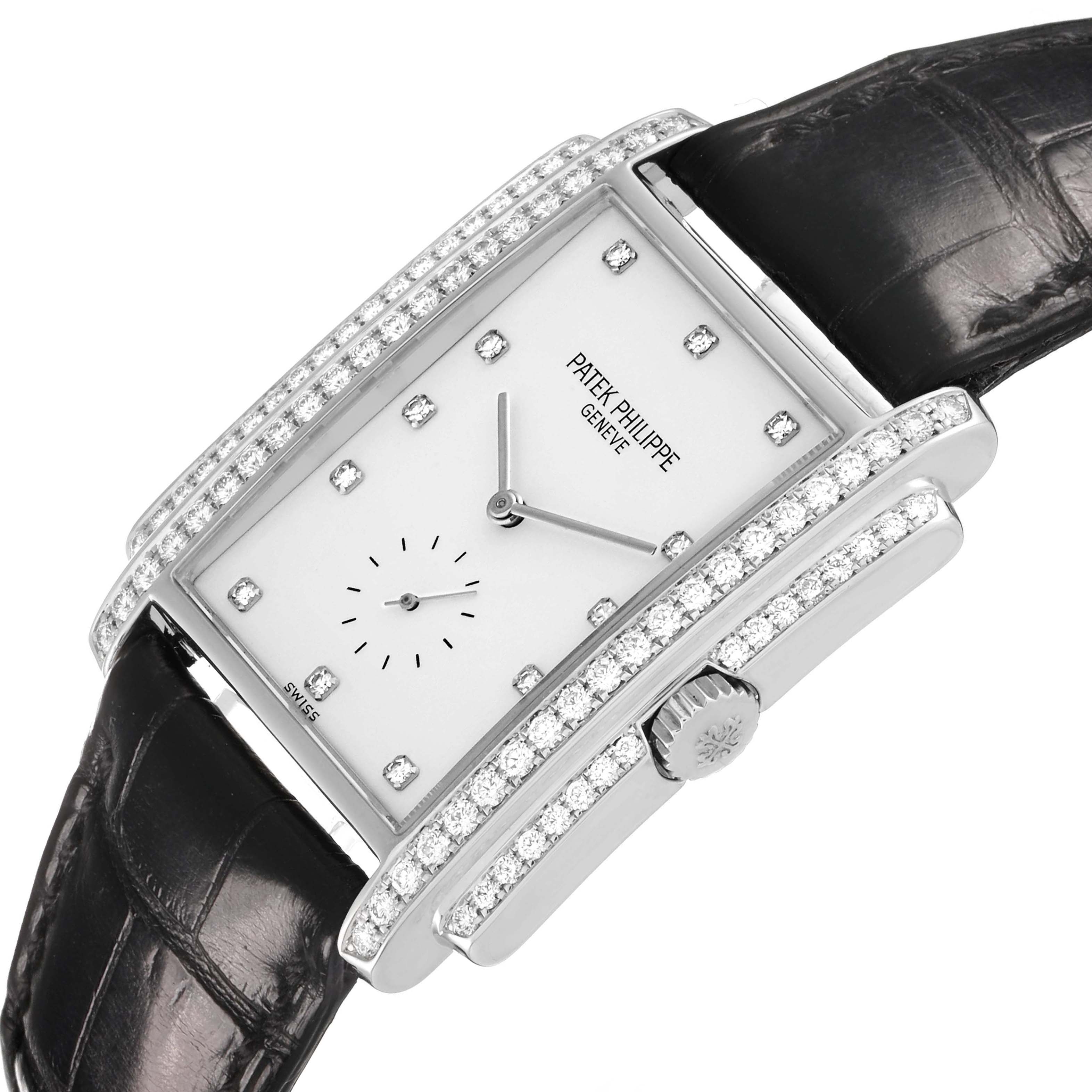 The Patek Philippe Gondolo 5025G Men's White Gold White Dial watch is shown at an angled view, highlighting its diamond-encrusted bezel, crown, and leather strap.