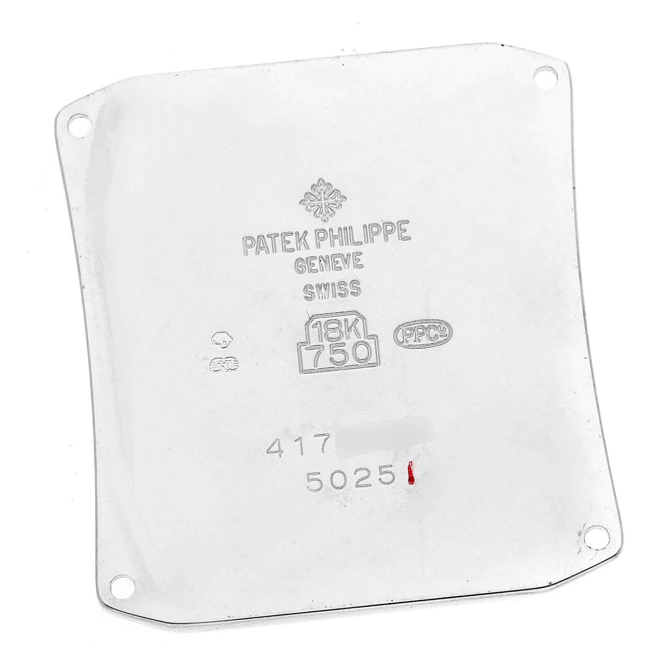 This image shows the back case of the Patek Philippe Gondolo 5025G Men's White Gold White Dial 5025G Men's White Gold White Dial watch, displaying brand engravings and hallmarks.