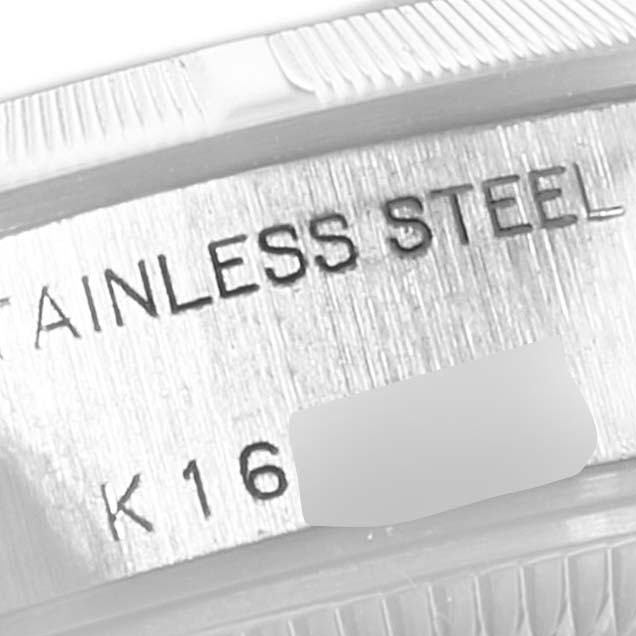 The image shows a close-up angle of the bezel and case side of a Rolex Date 79190 Women's Stainless Steel Blue Dial 79190 Women's Stainless Steel Blue Dial model watch, highlighting the "STAINLESS STEEL" engraving.