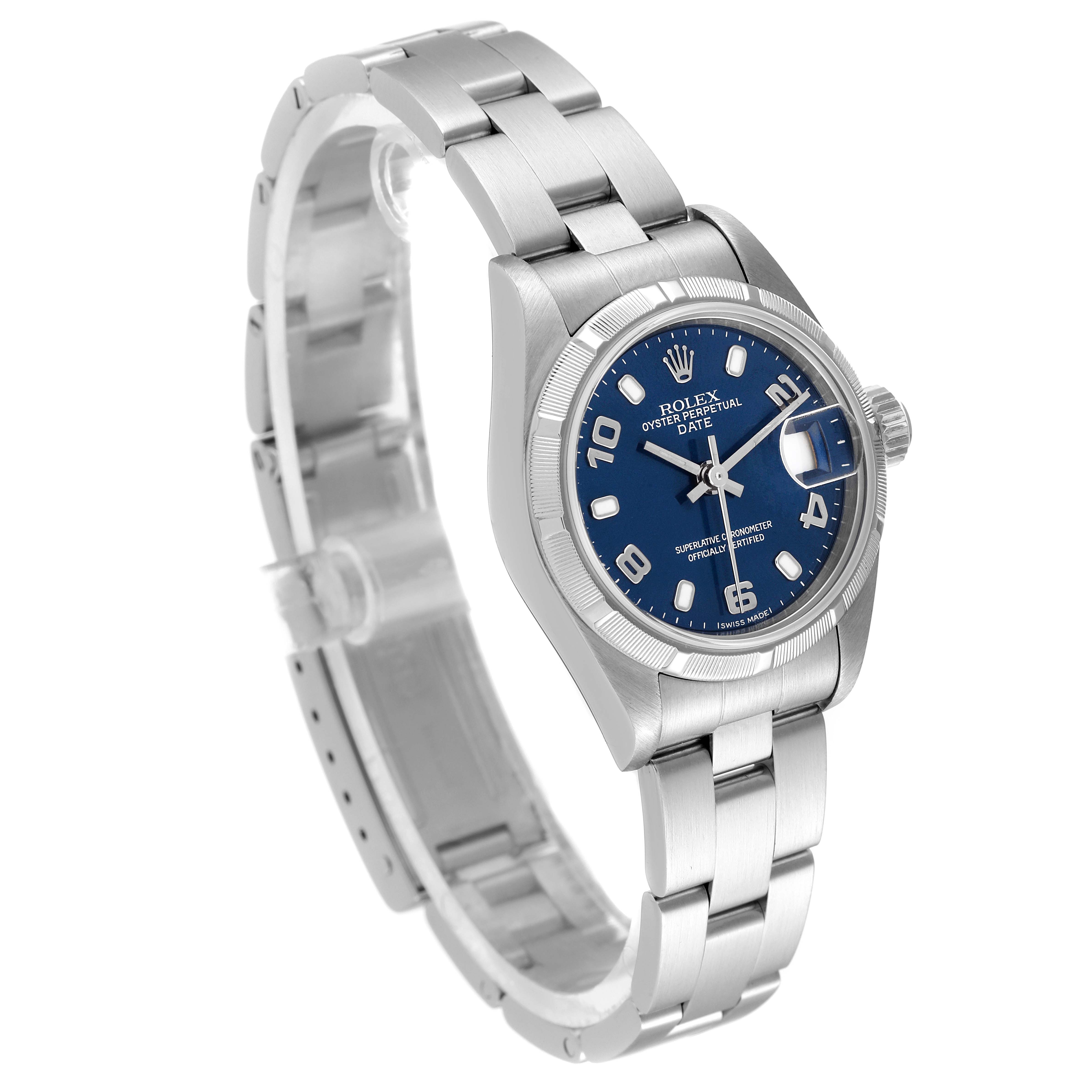 The image shows a Rolex Oyster Perpetual Date model watch, displayed at an angle highlighting the watch face, bezel, and bracelet.